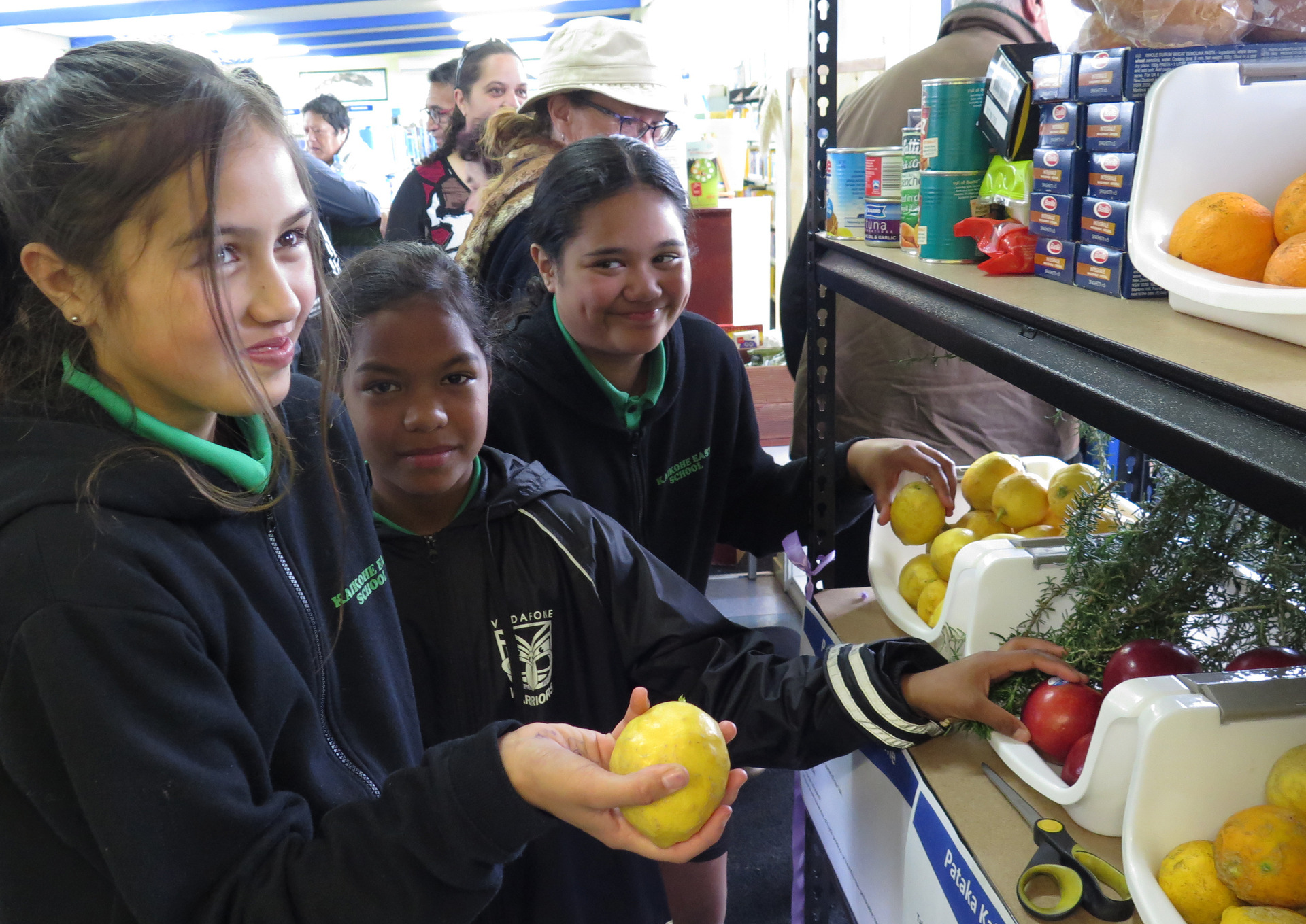 Kaikohe East School pupils, from left, Angel Holt, 11, Anahera Peri, 11, and Te Mana Haa Mason, 10, check out the new pataka kai at Kaikohe Library. Photo / Peter de Graaf 