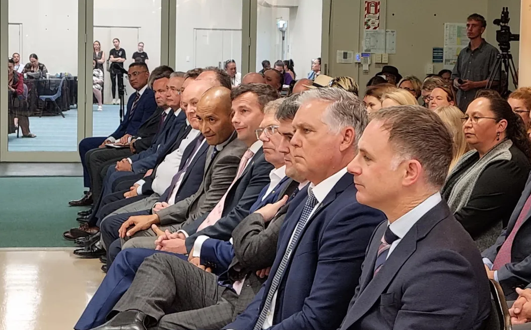 Minister for Māori-Crown Relations Tama Potaka next to Act leader David Seymour, alongside other Government ministers. Photo: Anneke Smith/RNZ