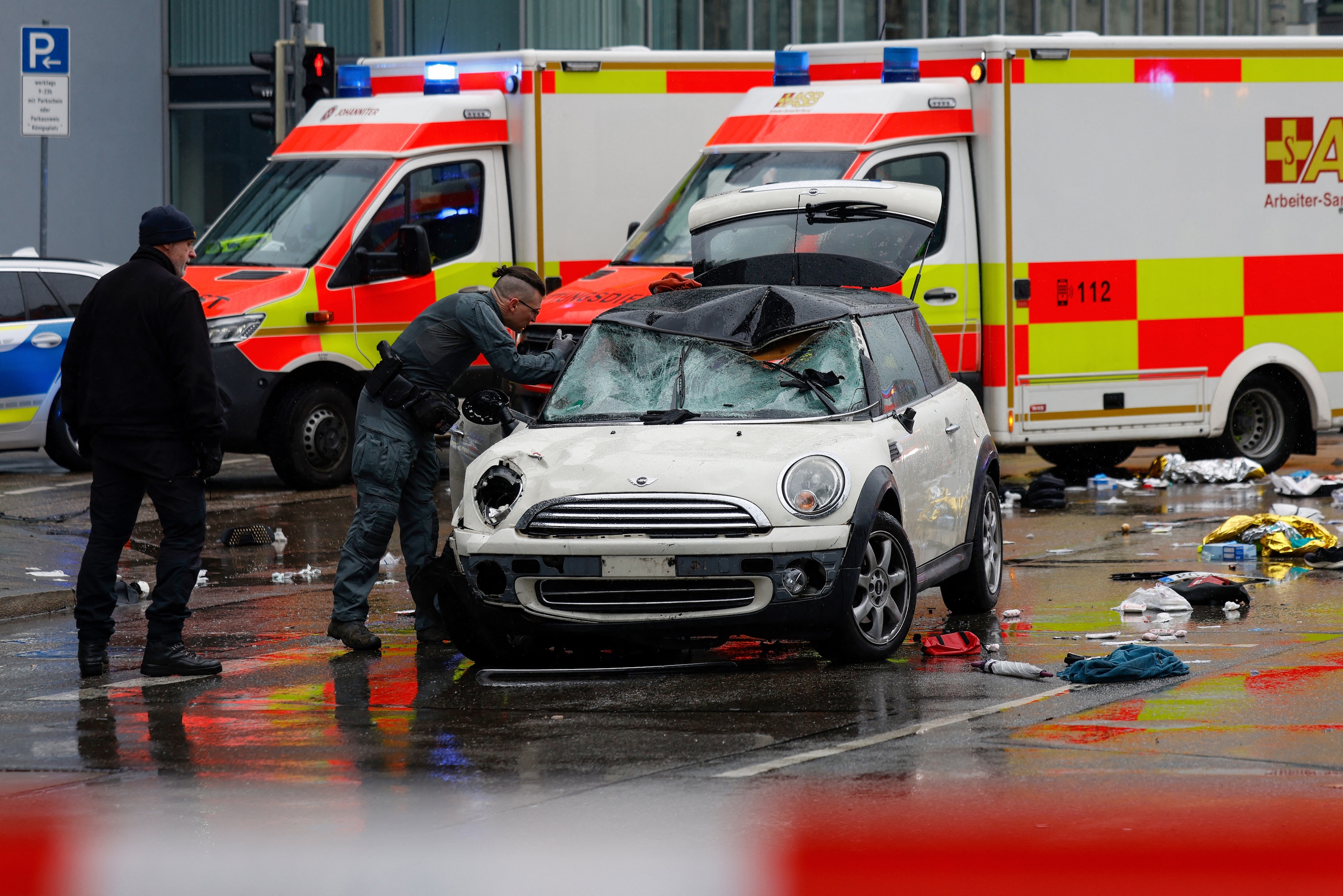 Members of the emergency services work at the scene where a car drove into a crowd in the southern German city of Munich. Photo / AFP