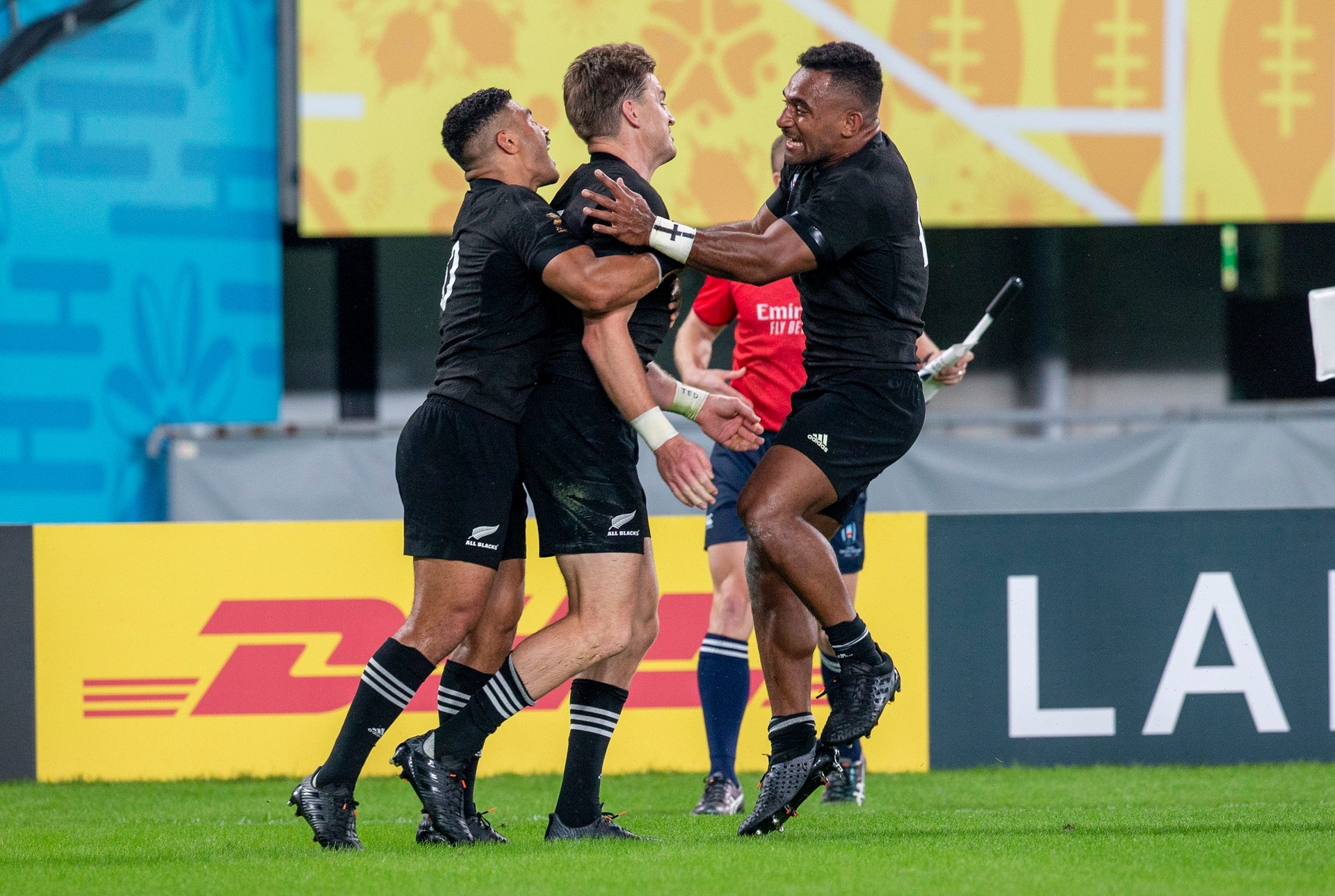 Richie Mo'unga and Sevu Reece celebrate teammate Beauden Barrett's first-half try. Photo / Mark Mitchell   
