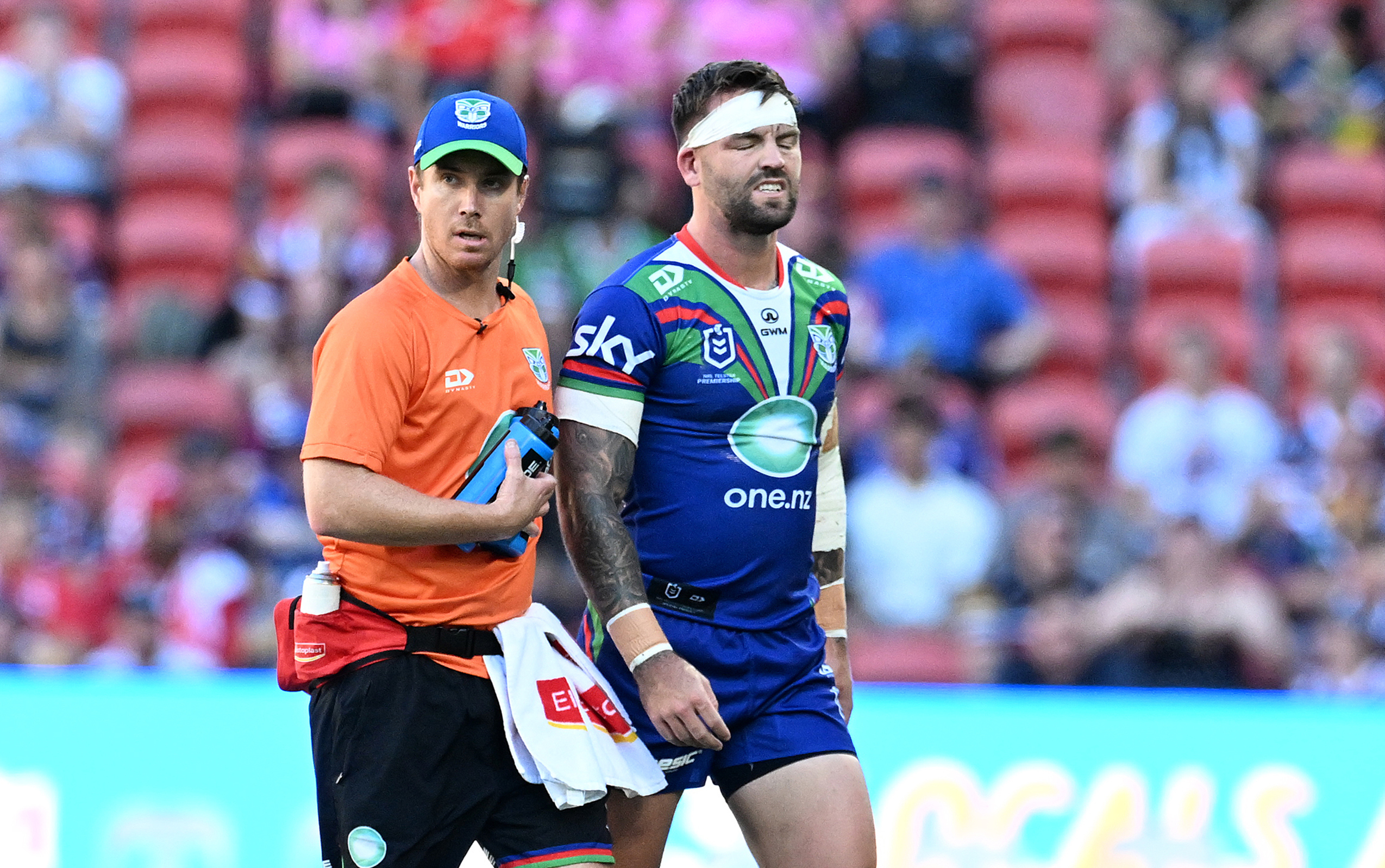 Wayde Egan is helped off the field after a head knock. Photo / Photosport