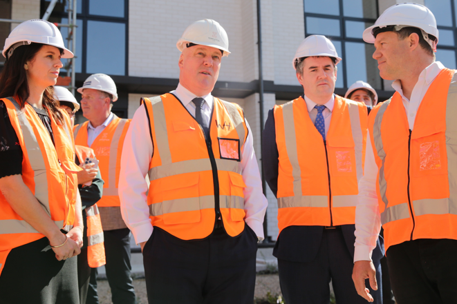 National ministers Erica Stanford (left), Prime Minister Christopher Luxon and Chris Bishop (right) at a Long Bay housing development. Photo / Sylvie Whinray