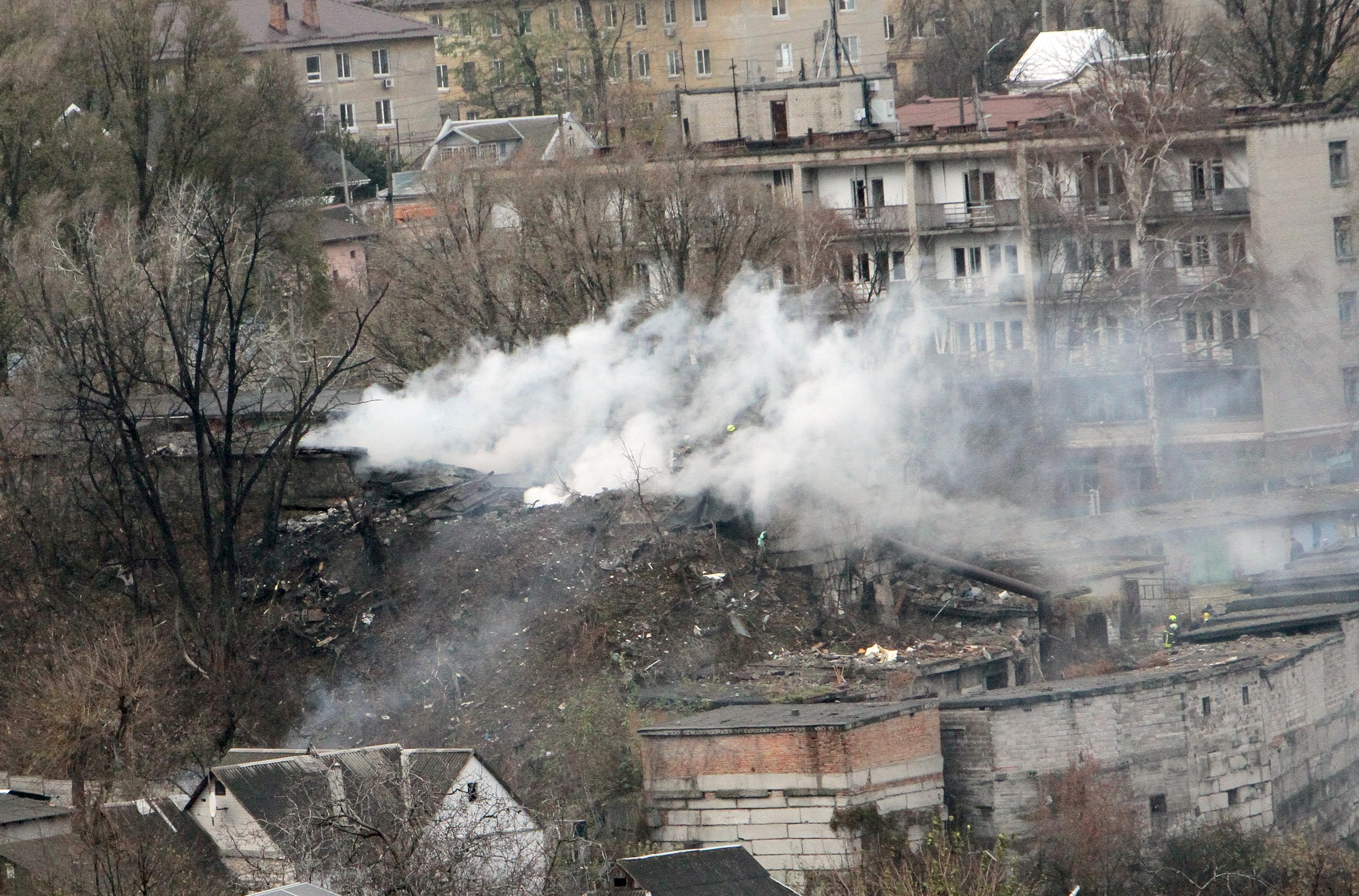 A pillar of smoke rises over a garage co-operative damaged by a Russian missile strike in Dnipro, Ukraine on November 21, 2024. Photo / Getty Images