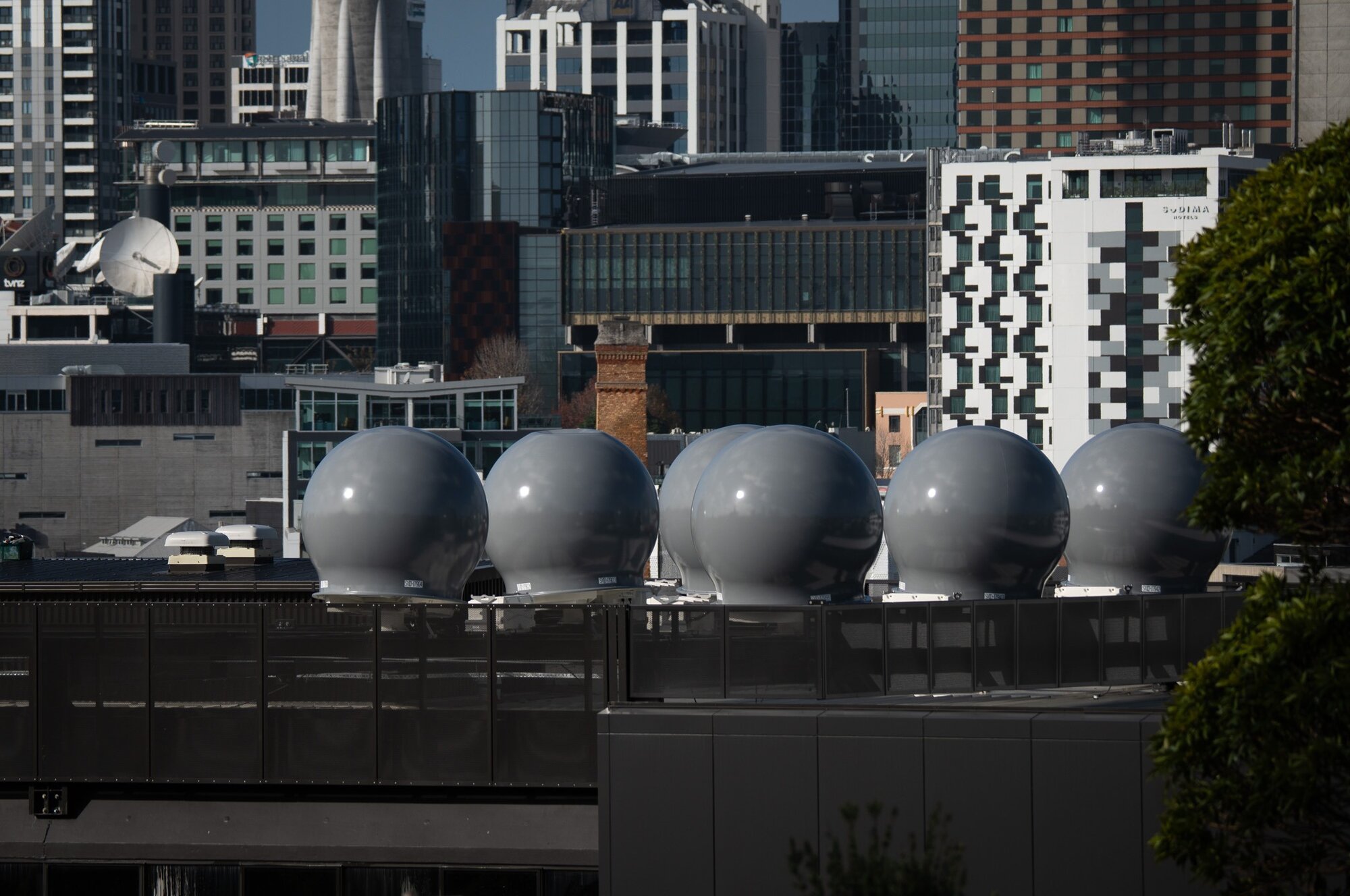The first dome-shaped antennas of a controversial satellite earth station in Auckland have been installed on a College Hill building's rooftop by 2degrees. Photo / Cameron Pitney