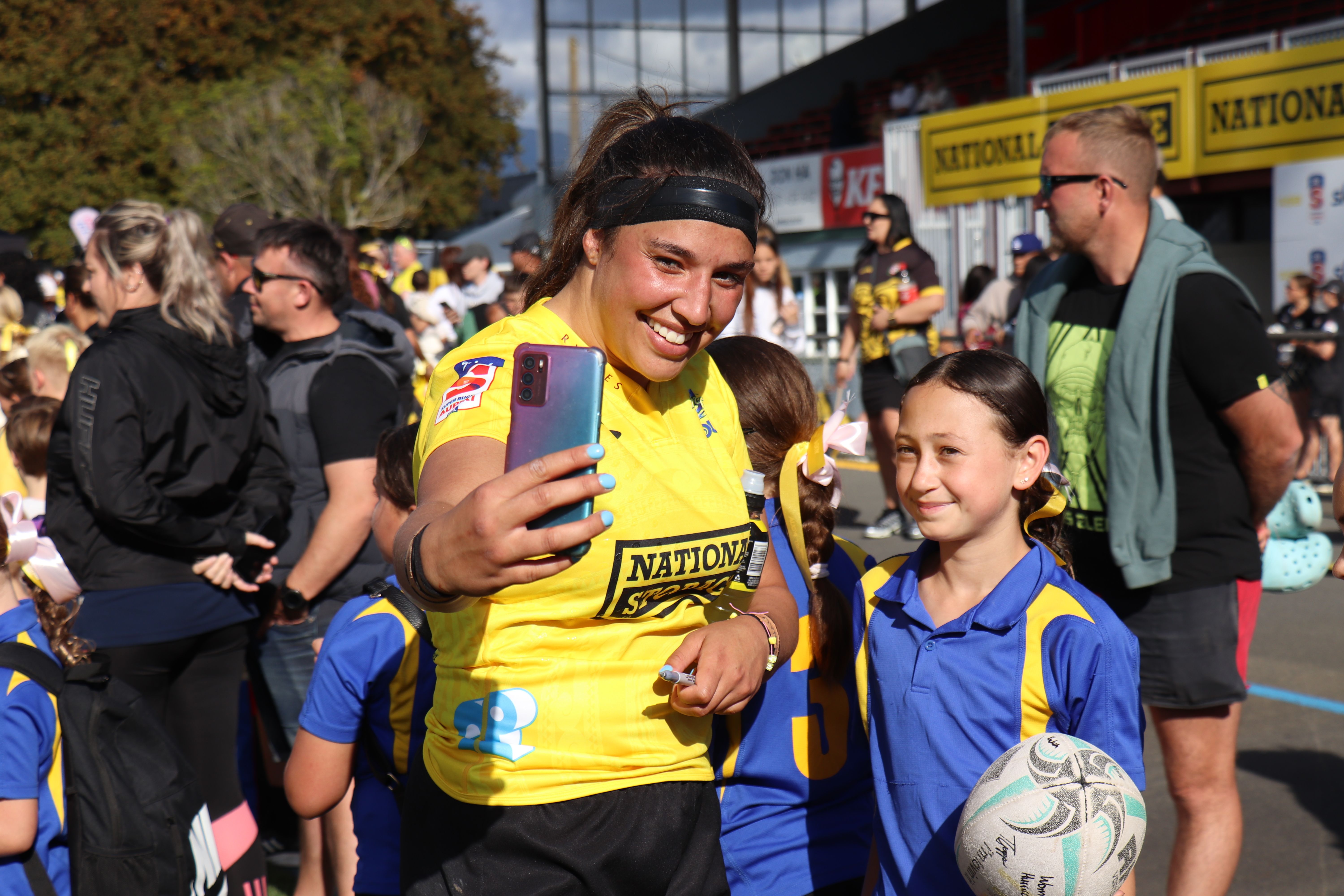 Hurricanes lock Kahurangi Sturmey gets a selfie with Holly Betty from Foxton after the game against the Blues at Levin Domain.