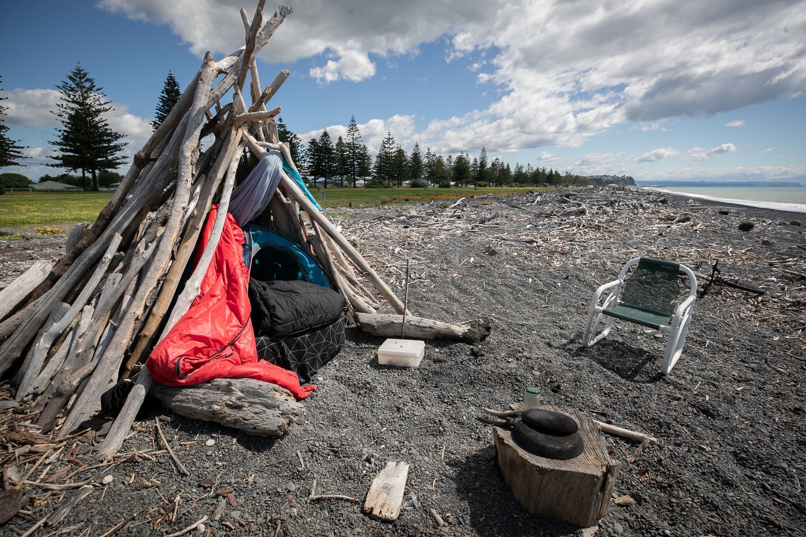 A log whare on Napier's Marine Parade beach, occupied by John until he was provided with temporary accommodation. It is one of many along the stretch of stony coastline. Photo / Warren Buckland