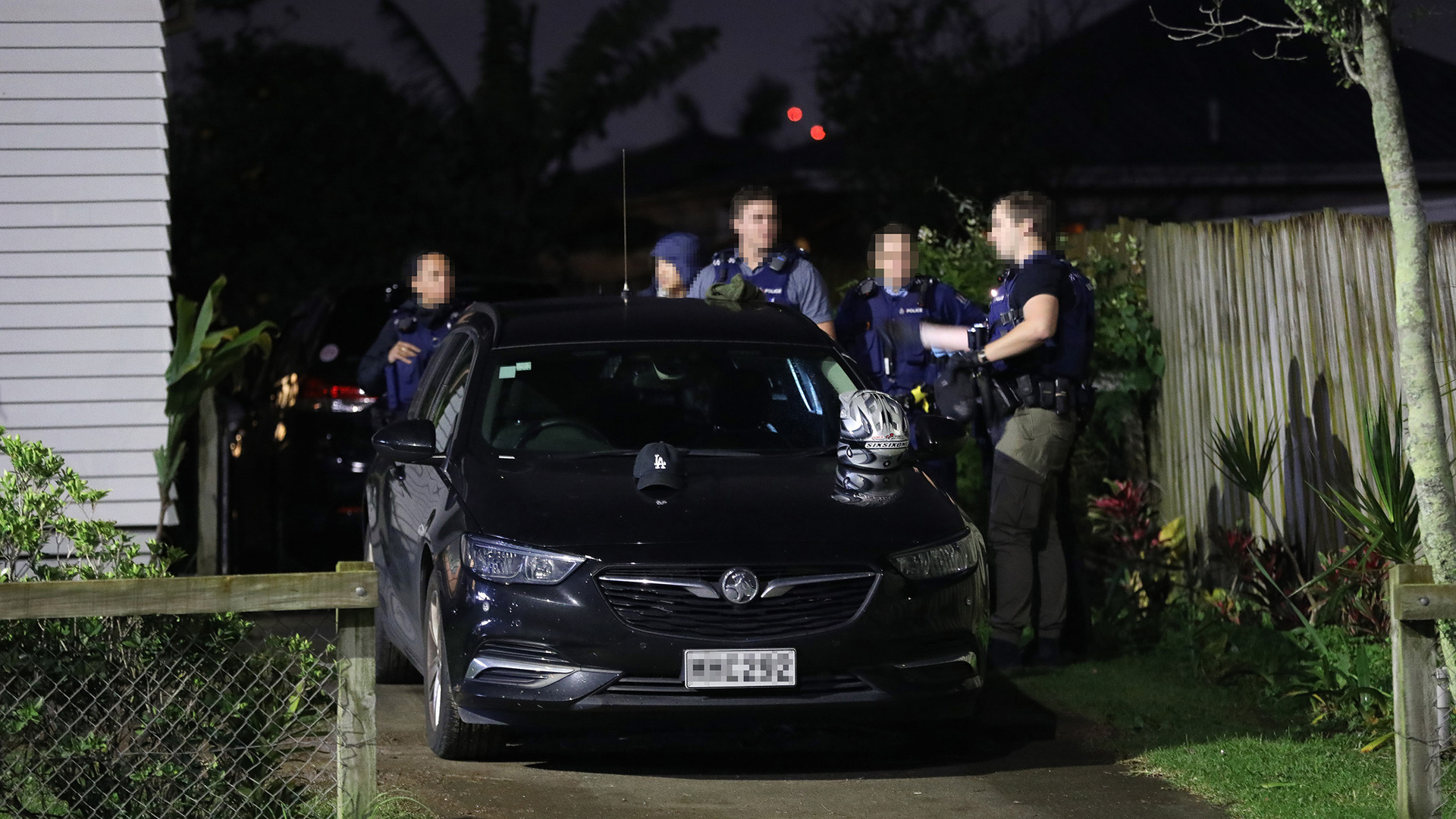 Armed police during a raid on a property at Pt England on Monday night. Photo / Hayden Woodward