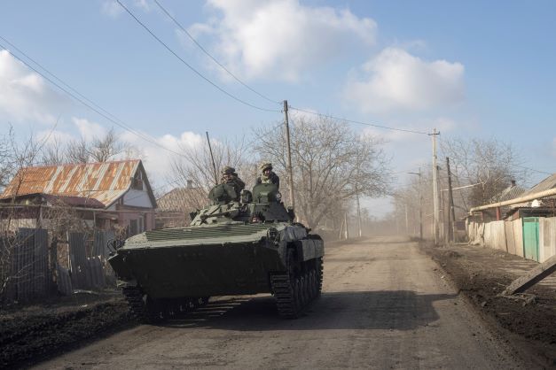 A Ukrainian APC drives towards frontline positions near Bakhmut, Ukraine, on Saturday. Photo / AP