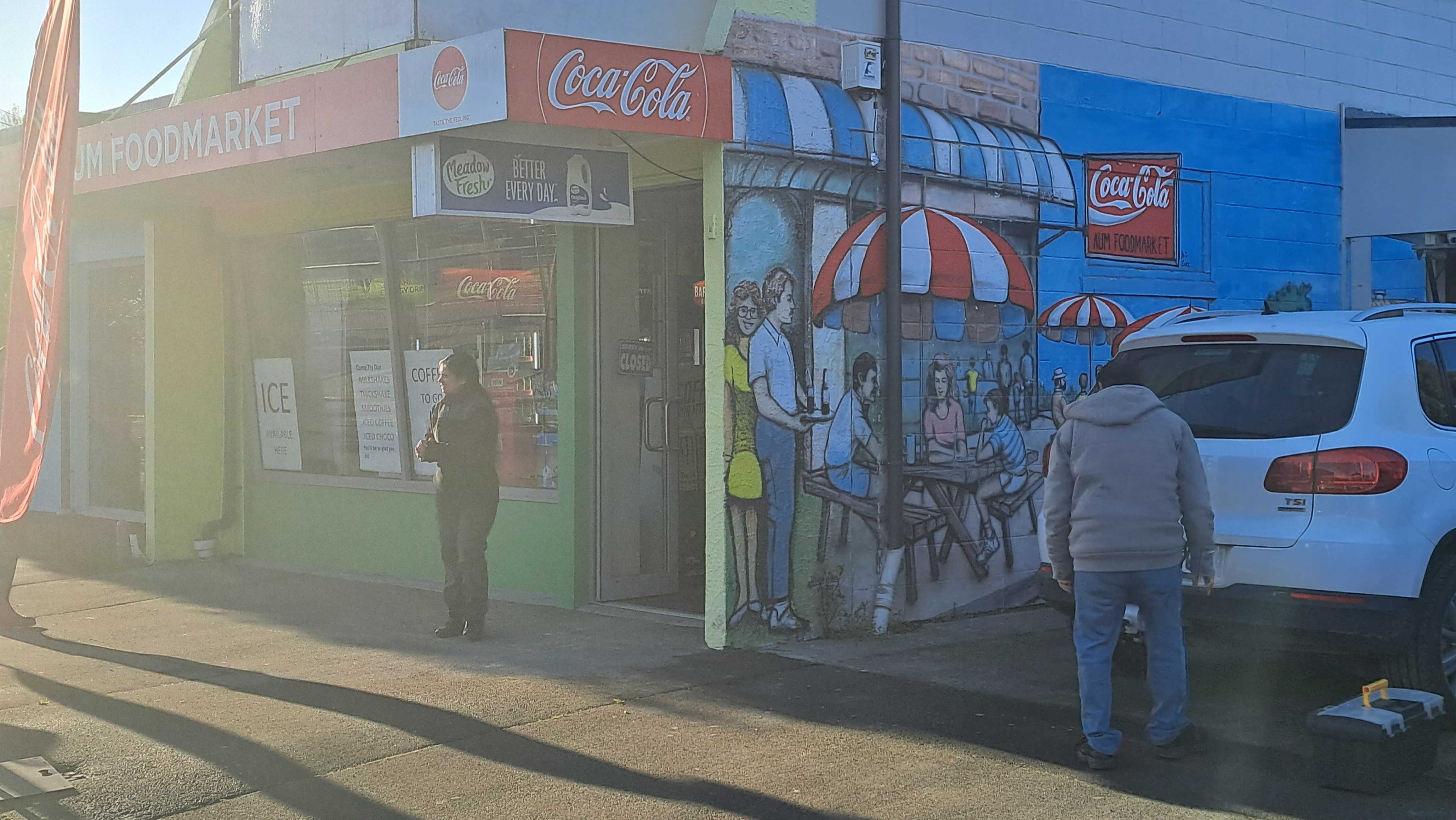 Preeti Patel stands outside her dairy, one of seven stores broken into across the city overnight.