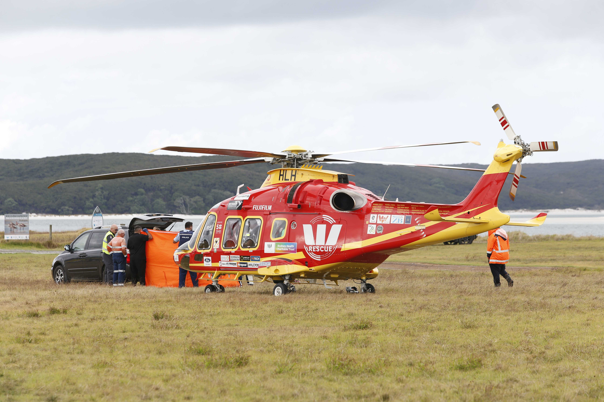 The Westpac rescue helicopter at Te Pua in the Far North after returning with a victim. Photo / Michael Cunningham