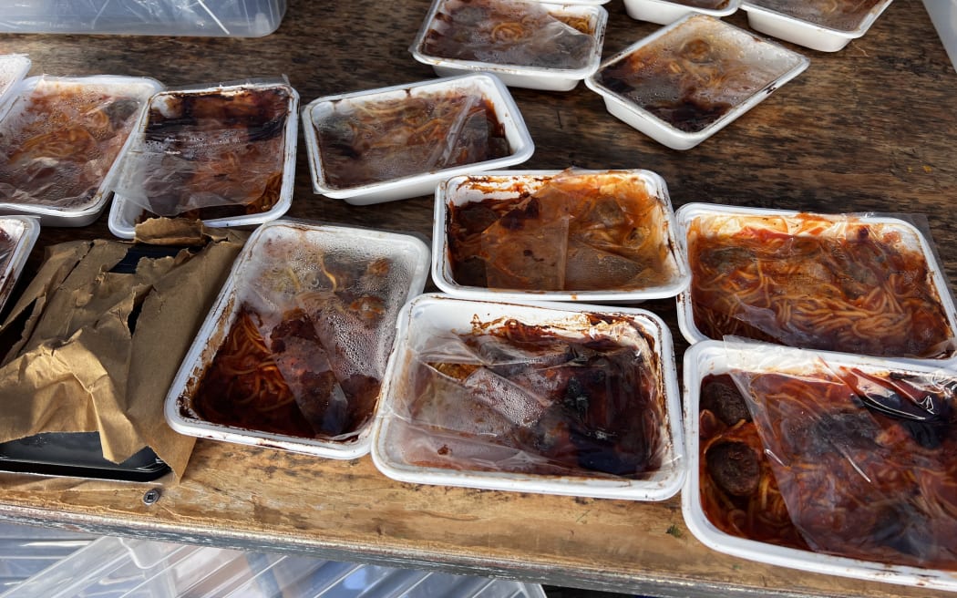 The picture shows the lunches the Whangarei school received with their packaging already coming off and burnt. Photo / Supplied via RNZ