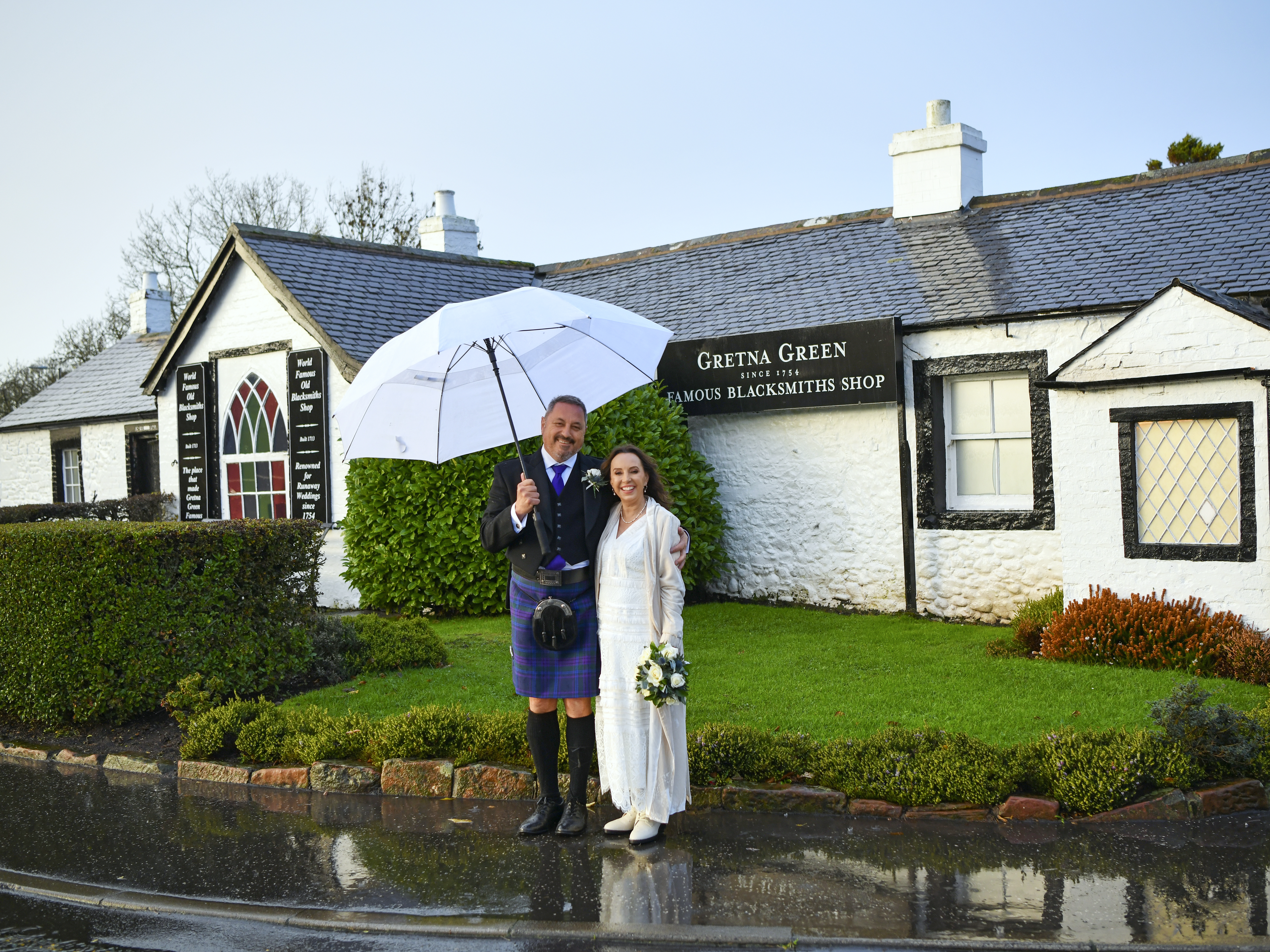 Rain didn't dampen the happy couple's big day. Photo / Supplied. 
