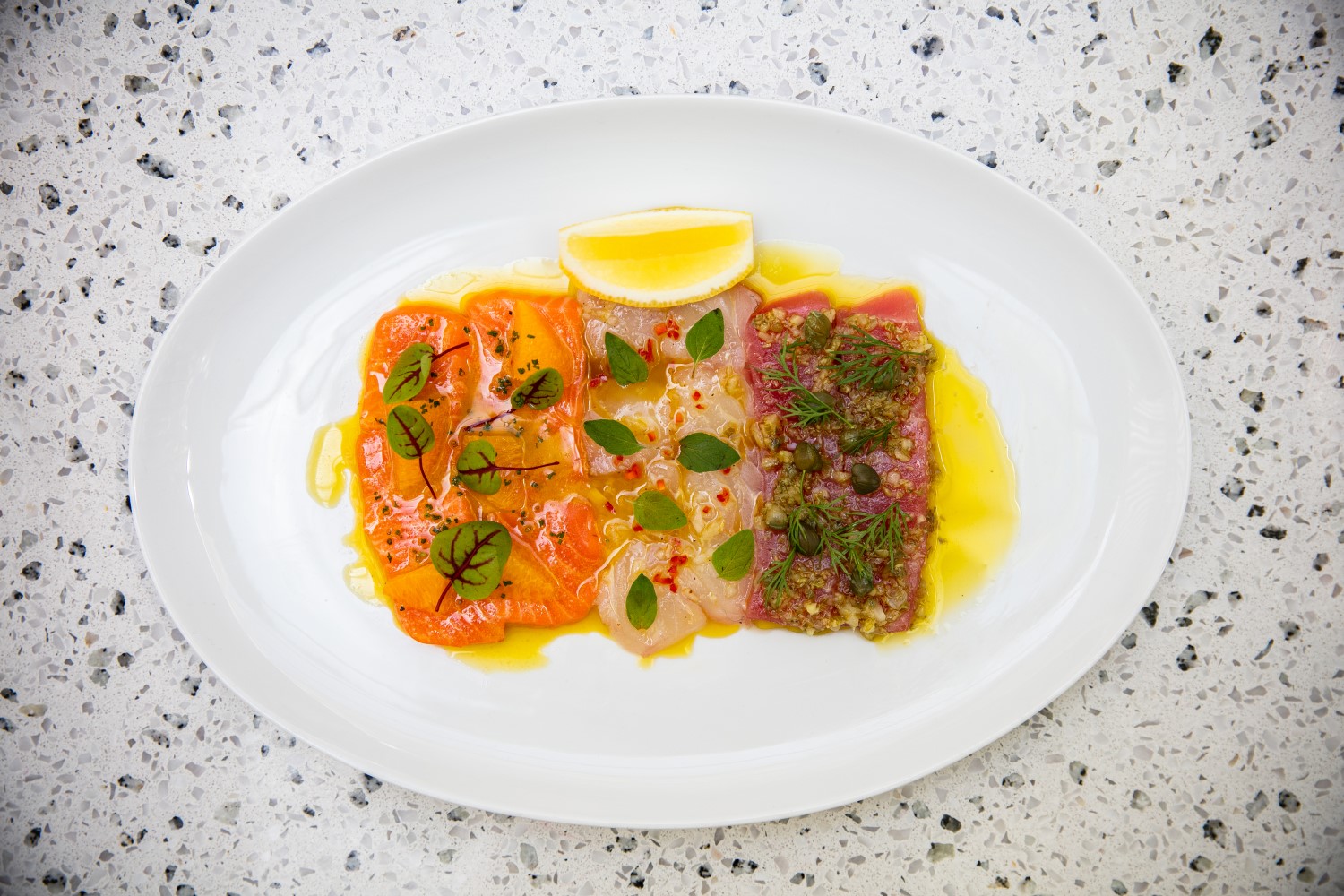 The crudo plate heroes salmon, tuna and snapper. Photo / Babiche Martens
