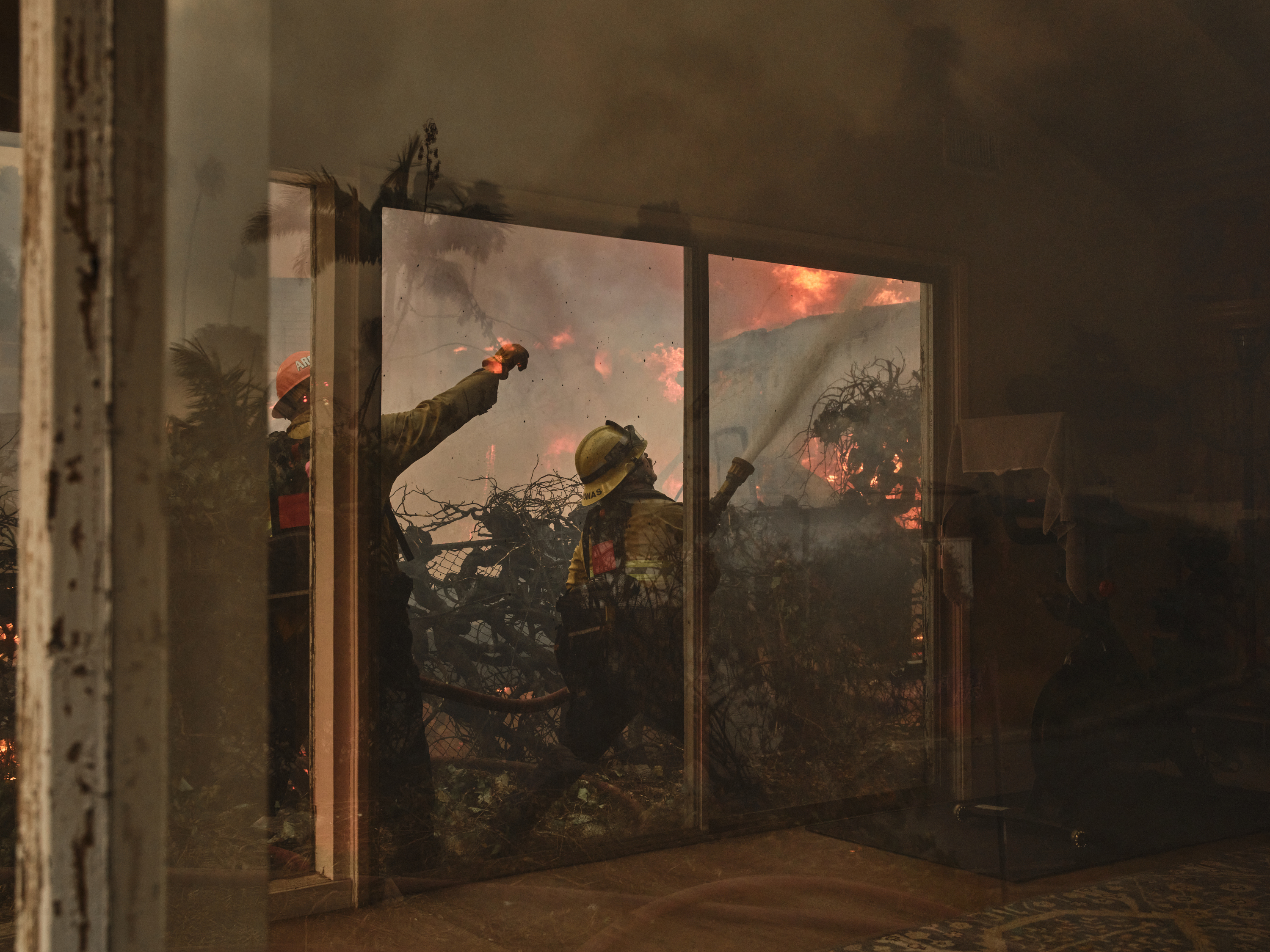 Firefighters last week work on the Pacific Palisades fire in Los Angeles, where nearly 52 sq km were under evacuation warnings within the first 45 minutes of the fire. Photo / Philip Cheung, The New York Times