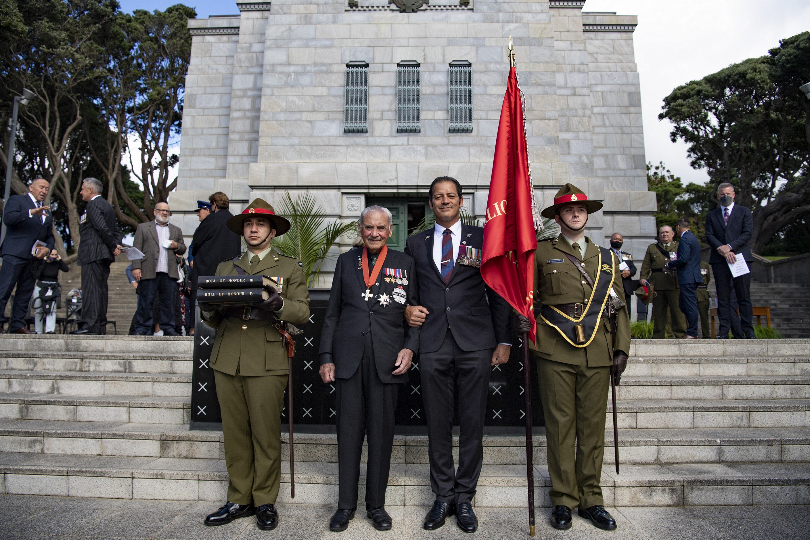 Sir Robert Gillies and Willie Apiata VC stand with the roll of honour and the 28 Māori Battalion banner. Photo / NZ Defence Force