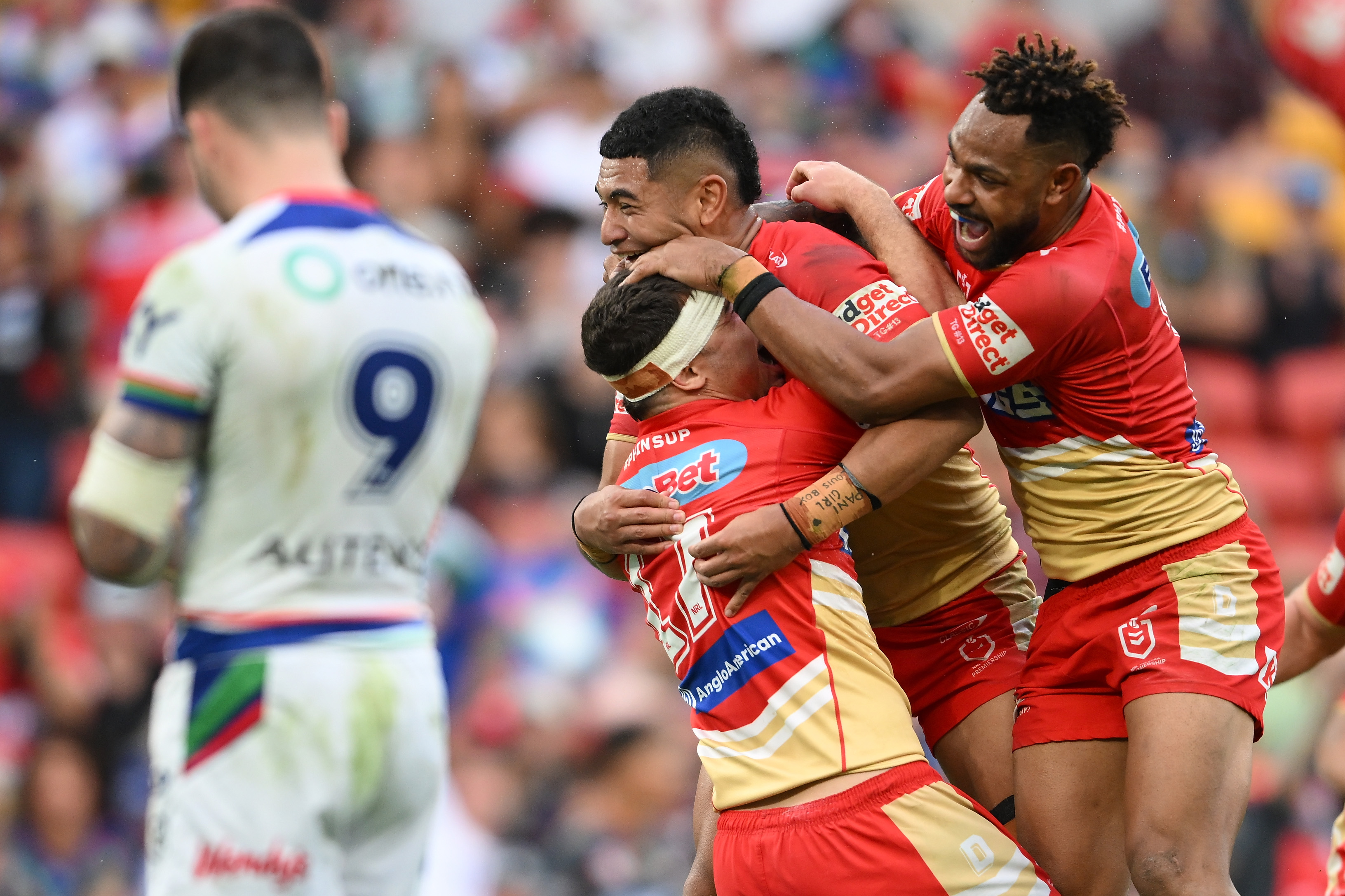 The Redcliffe Dolphins celebrate their golden-point win over the Warriors. Photo / Getty Images