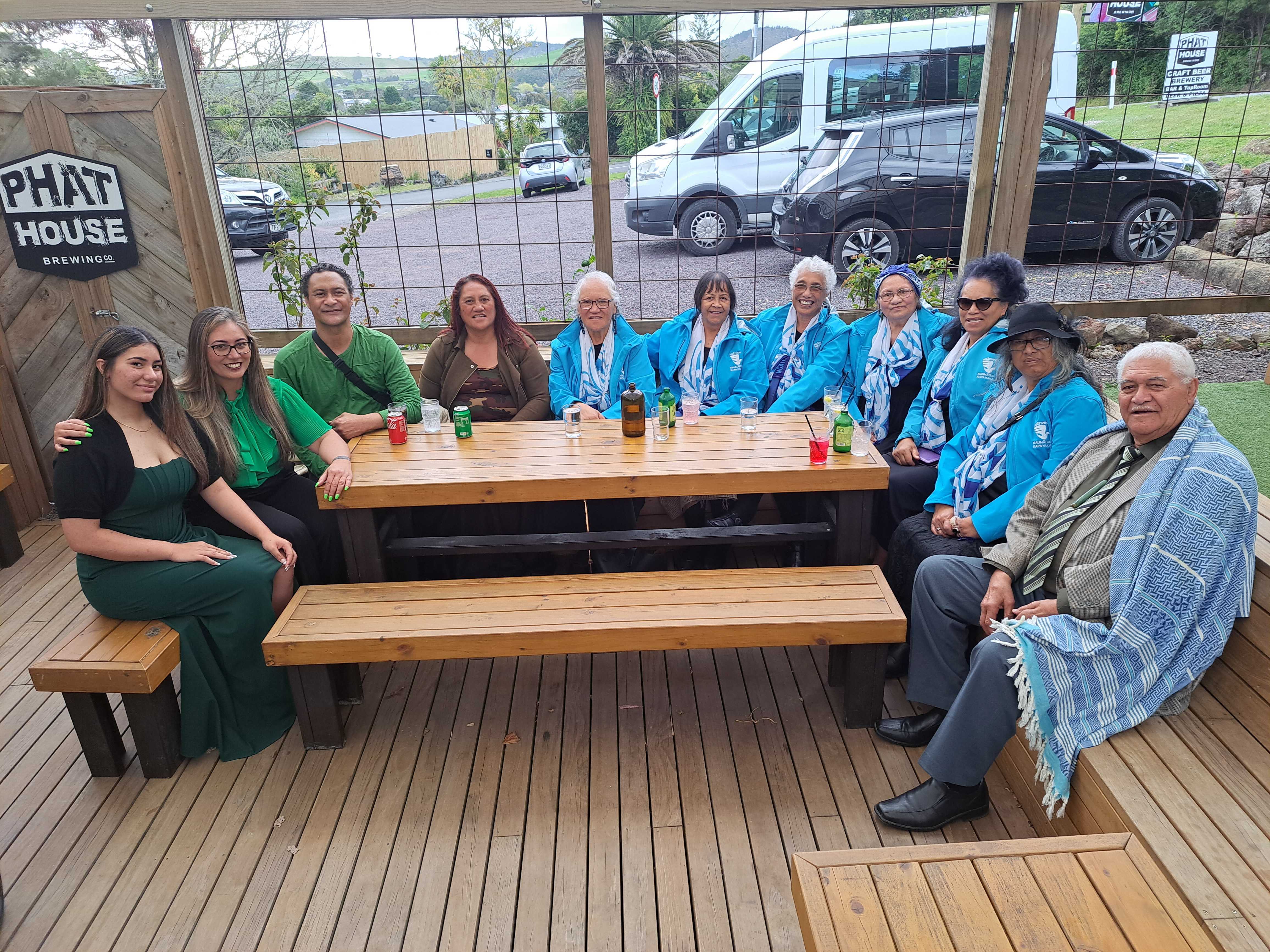 Green Party member Hūhana Lyndon (second from left) with supporters from Ngatiwai Kaumātua Kapa Haka group who will perform later in the evening. Photo / Jenny Ling