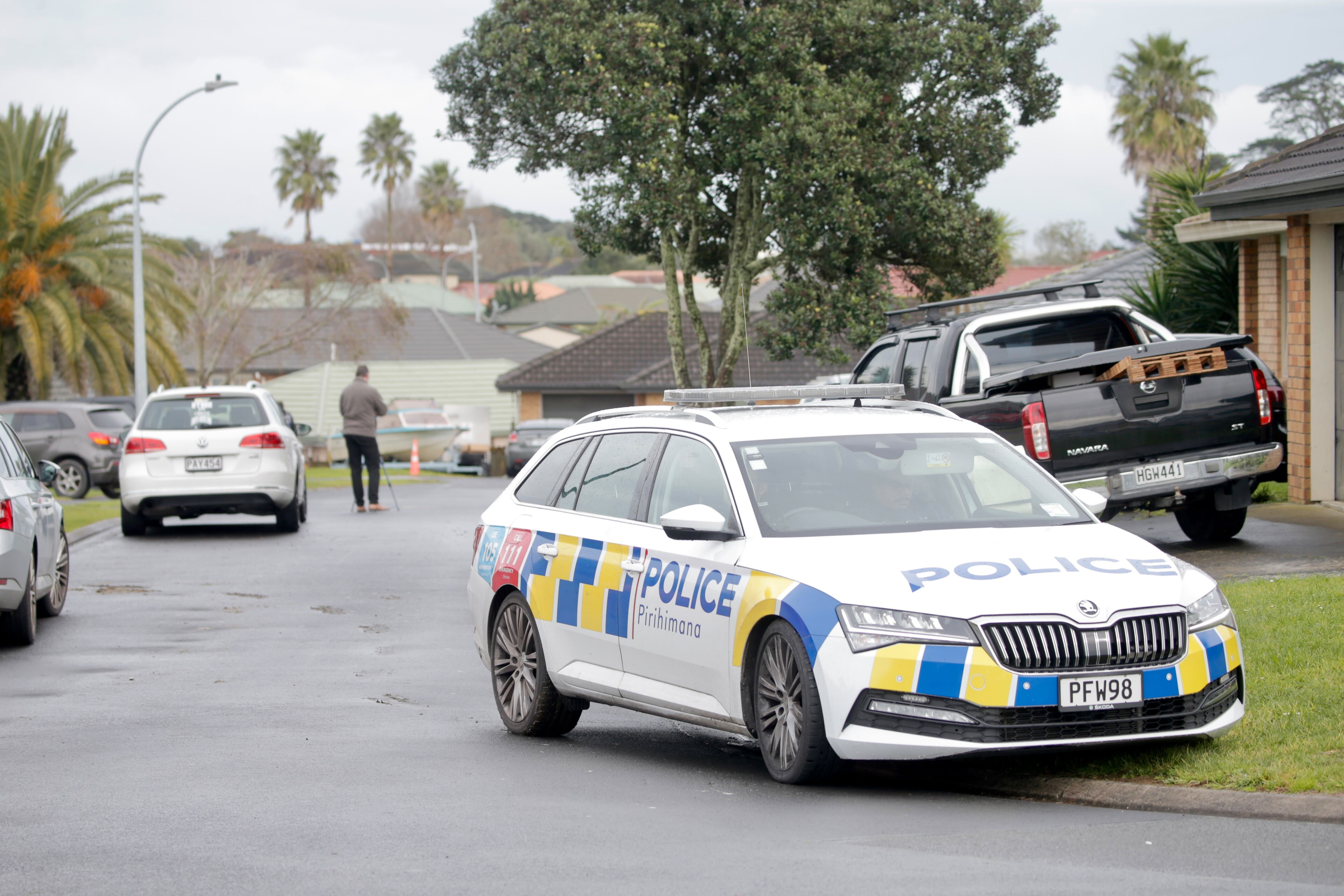 Police at Outrigger Pl, Māngere in Auckland after gunshots were fired at a house overnight. Photo / Alex Burton
