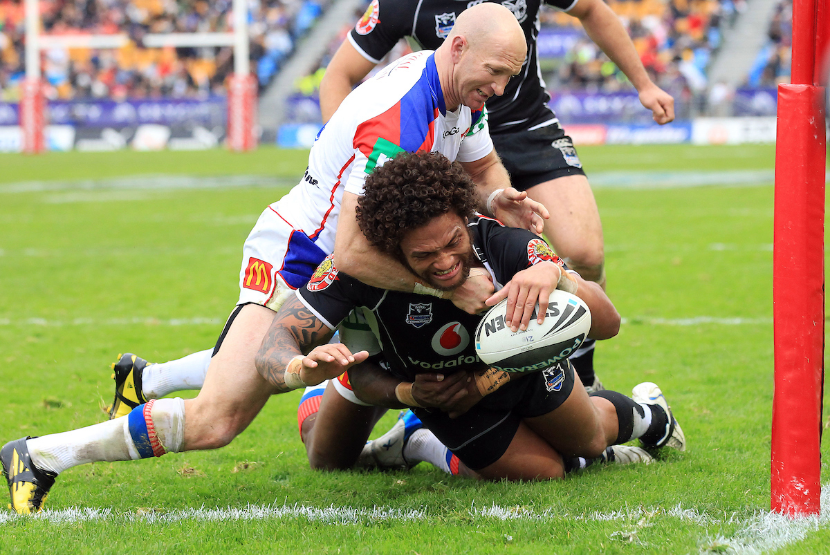 Warriors winger Manu Vatuvei dives to score a try against Newcastle in a 2010 clash. Photo / Photosport