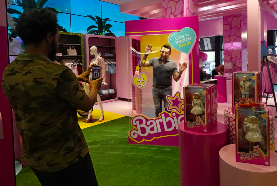 A man poses inside a large Barbie doll box in Bloomingdale's, New York. Photo / AP