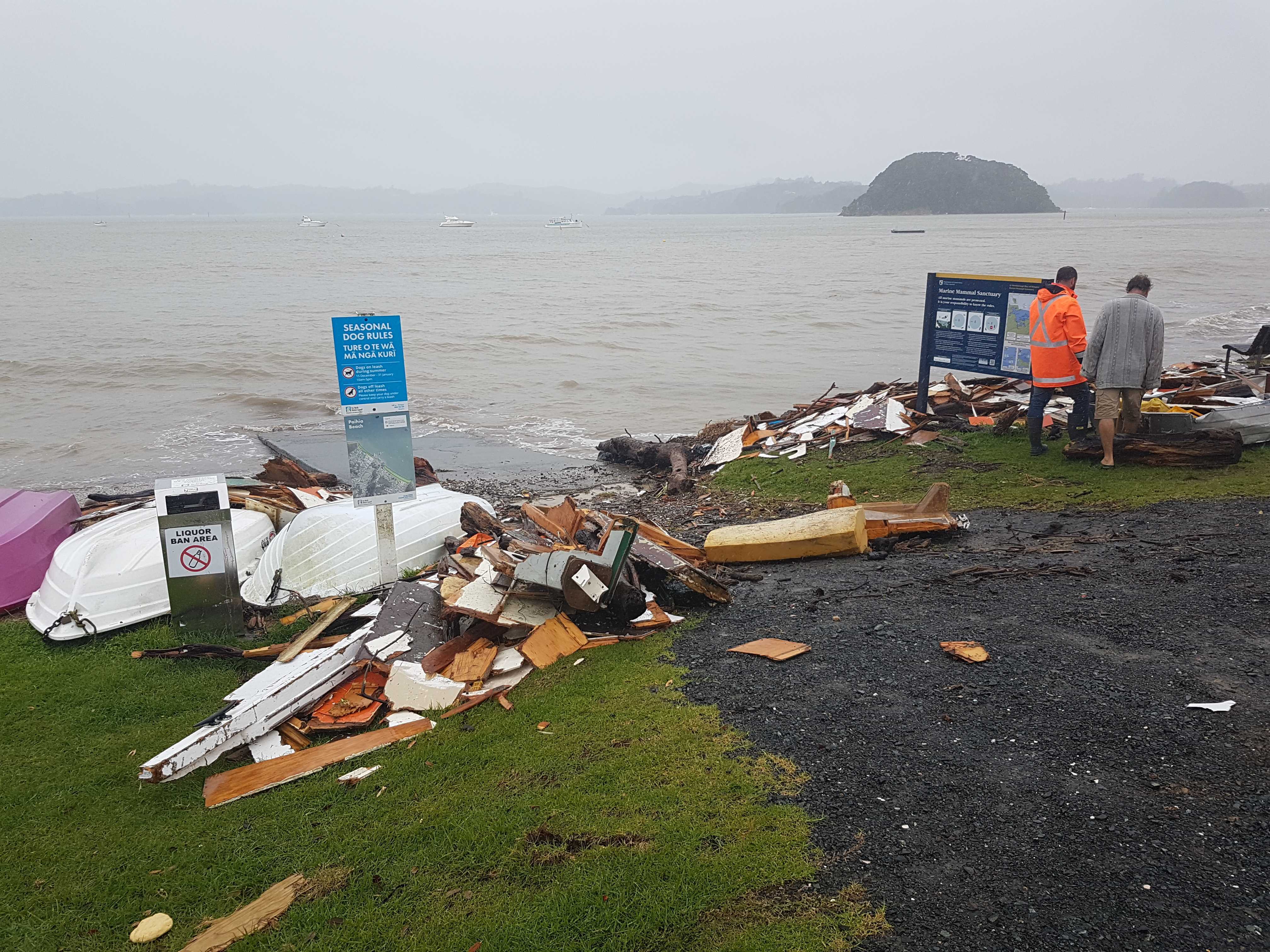 The wreckage of a yacht scattered across the length of Paihia's main beach due to Cyclone Gabrielle. Photo / Peter de Graaf