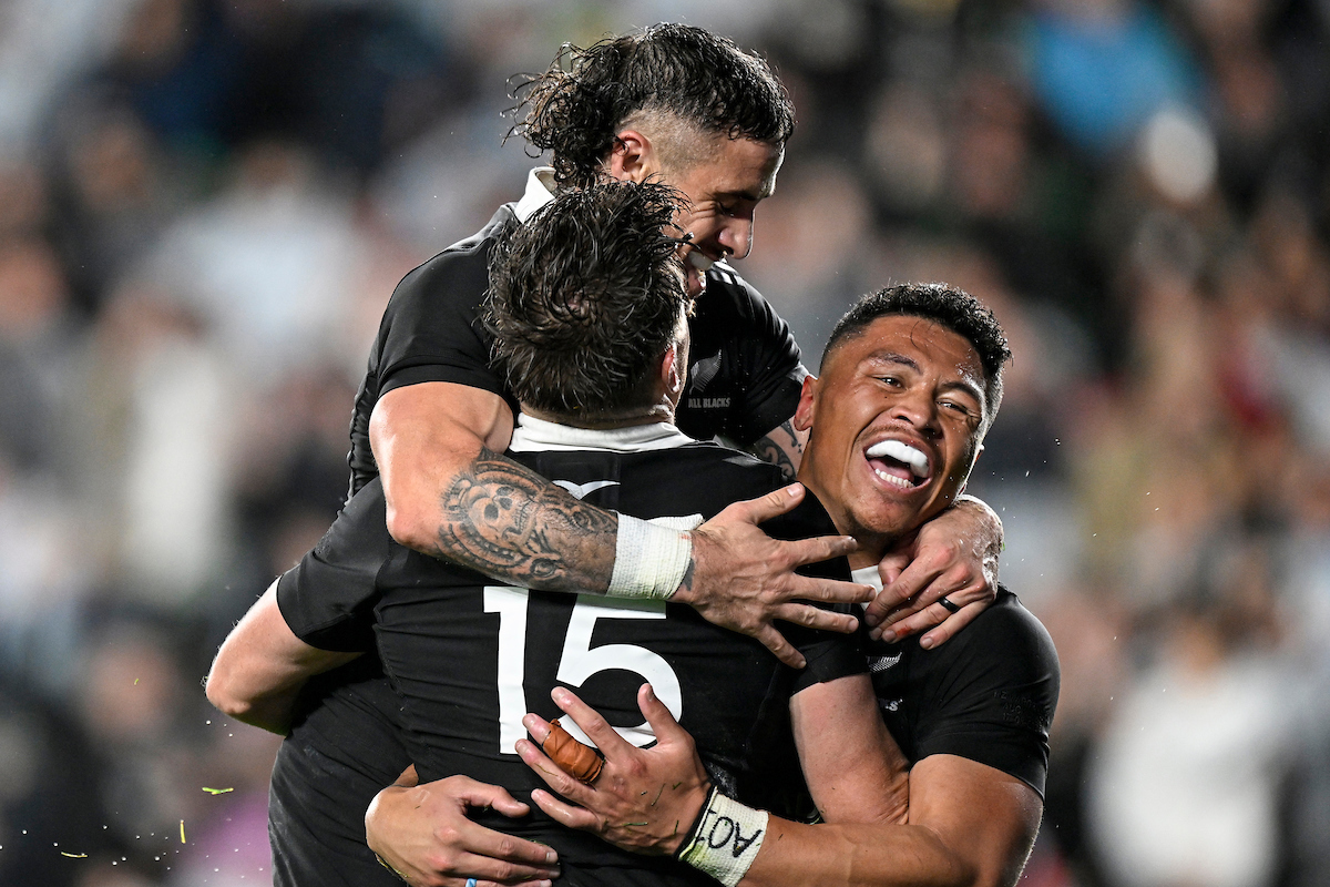 Beauden Barrett celebrates his try with TJ Perenara and Caleb Clarke during the Rugby Championship clash against Argentina at Eden Park. Photo / Photosport