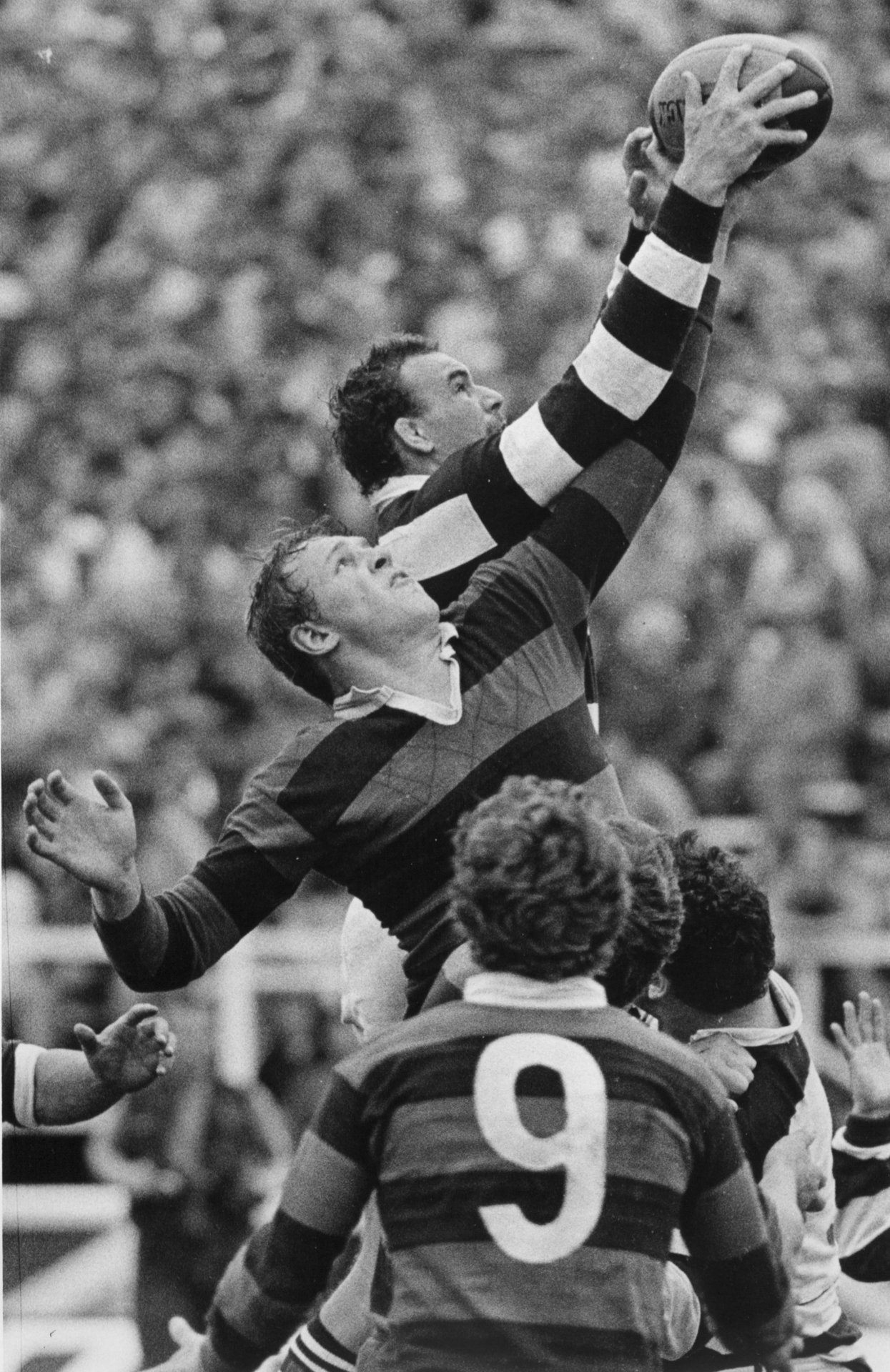 Albert Anderson leaps high to spoil Andy Haden's two-handed take during the Ranfurly Shield challenge between Auckland and Canterbury in September 1983. Photo / Paul Estcourt