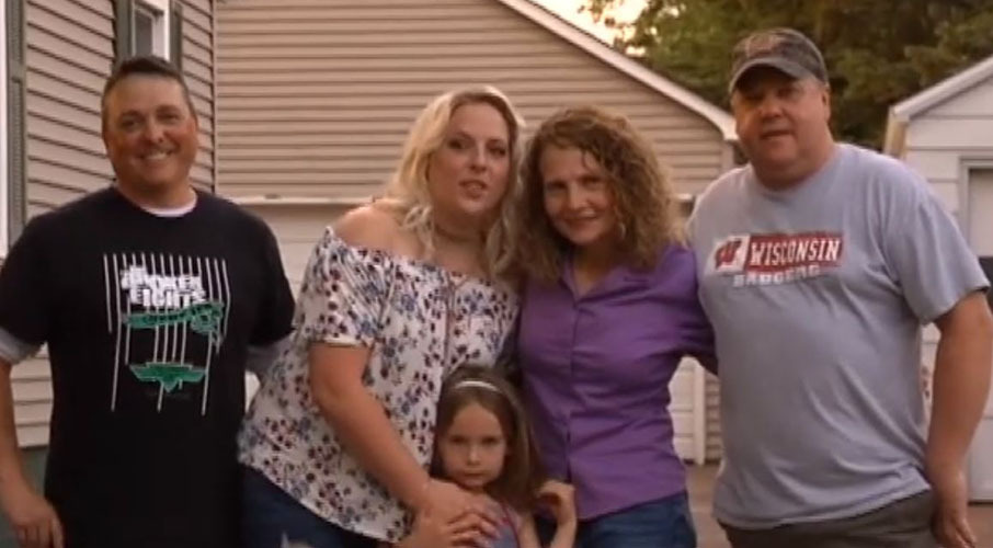 Hillary and Dawn are pictured here with Hillary's husband Lance (far left) and daughter Stella (front) and Dawn's partner Kurt Casperson (far right) . Photo / Fox 8

