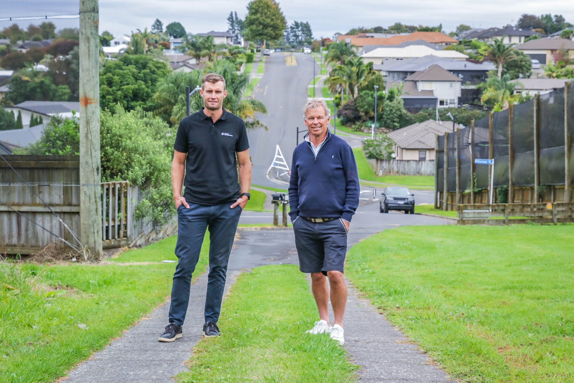 Classic Group national development manager Andre de Jong (left) and director Peter Cooney pictured in front of part of the original subdivision it developed in the early 2000s. Photo / Kelly O'Hara