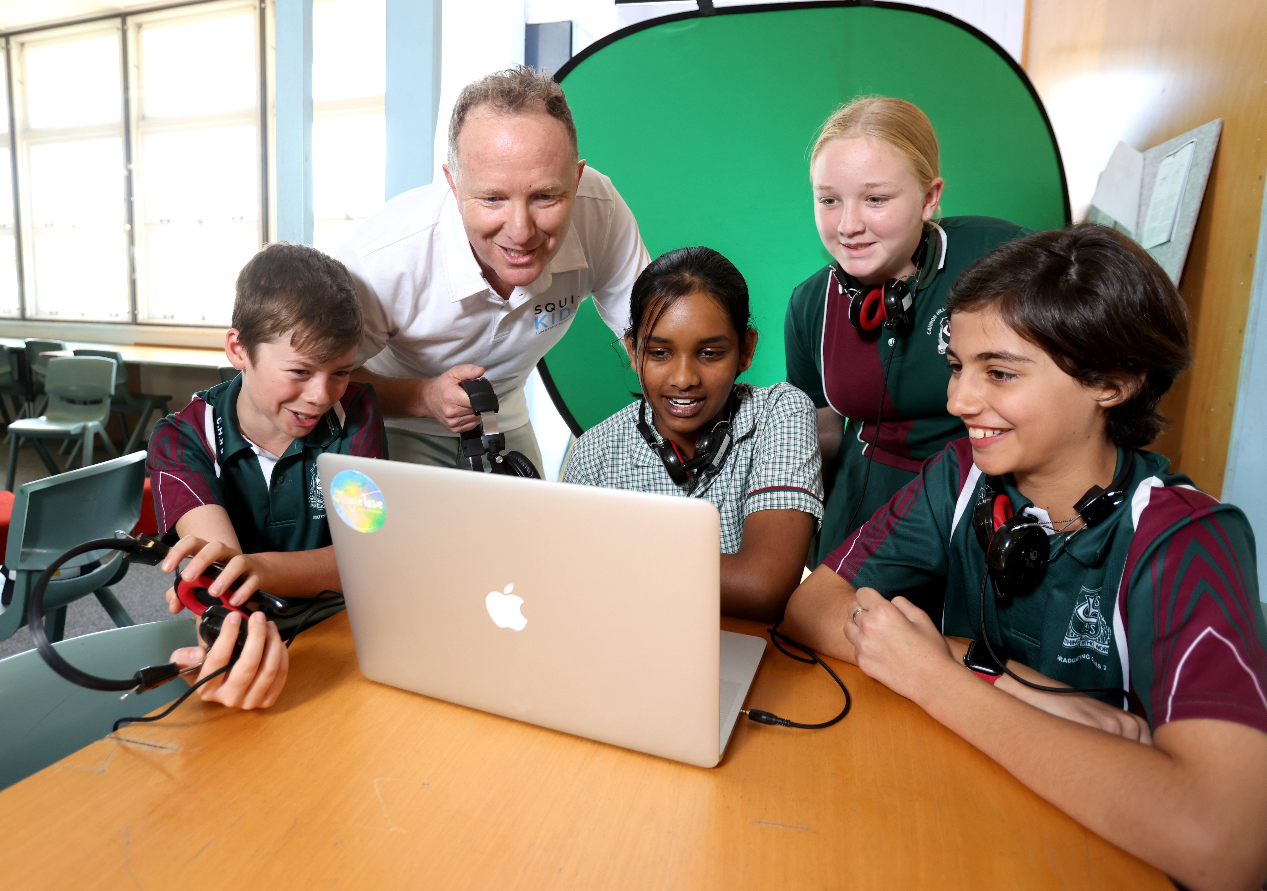 Media executive Bryce Corbett at a school in Australia demonstrating Newshounds, a free initiative aimed at teaching primary school-age children to detect online misinformation. Photo / Courier Mail