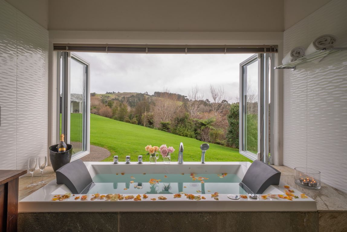 The tub takes full advantage of the countryside so bathe with the blinds open and absorb the views. Photo / Supplied