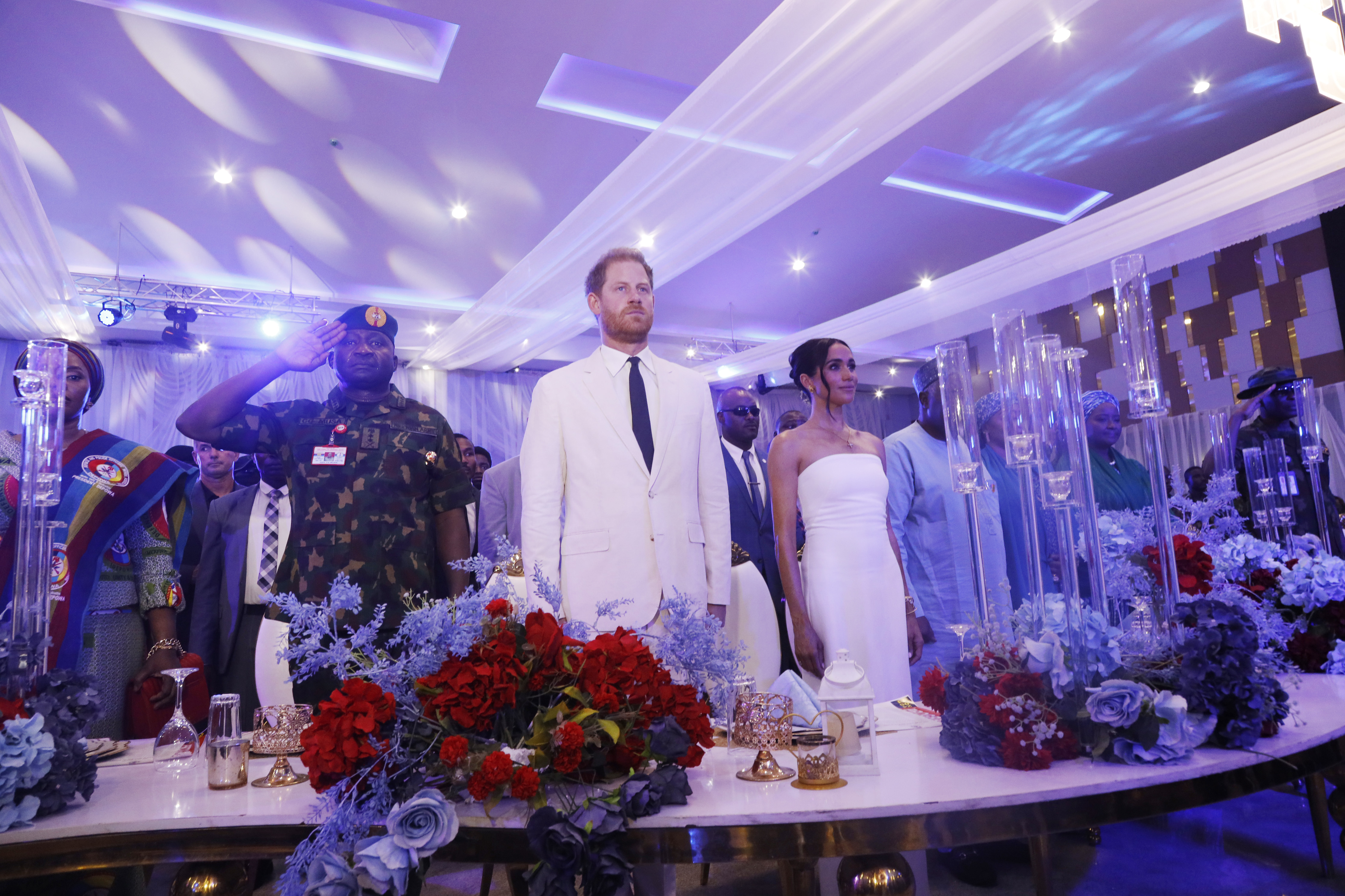 The couple appeared to look uncomfortable during a dinner in which the British national anthem was sung. Photo / Getty Images