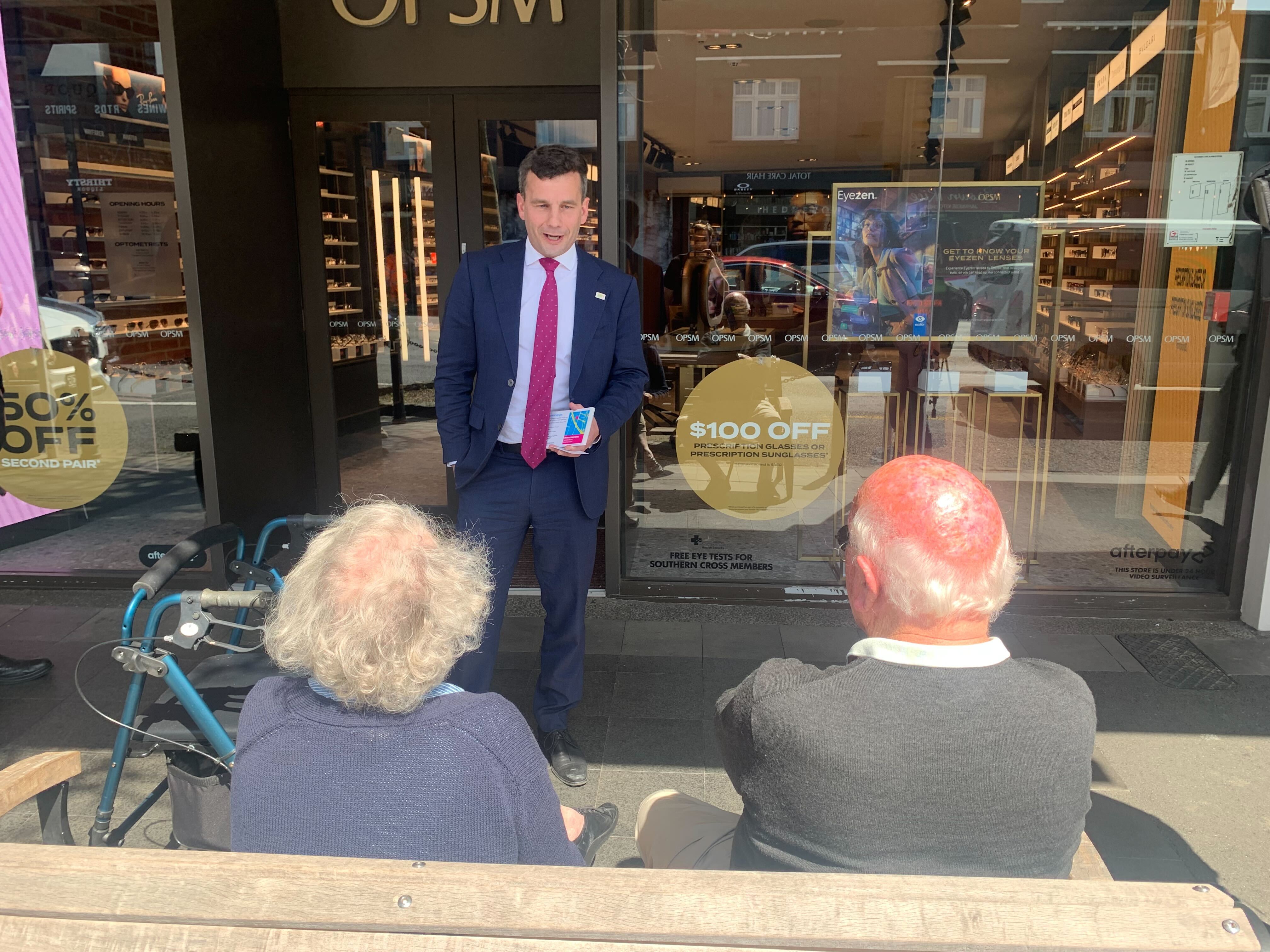 Act Party leader David Seymour talks with an elderly couple enjoying the sunshine while the politician is on a walkabout in Remuera, Auckland. Photo / Adam Pearse