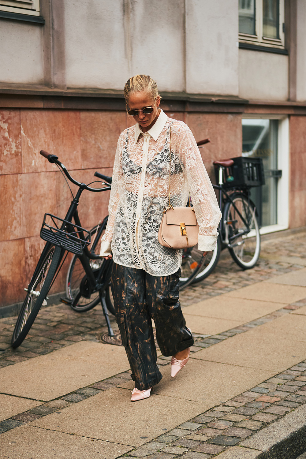 Street style: A lacy shirt is styled with relaxed-fitting pants. Photo / Simbarashe for The New York Times