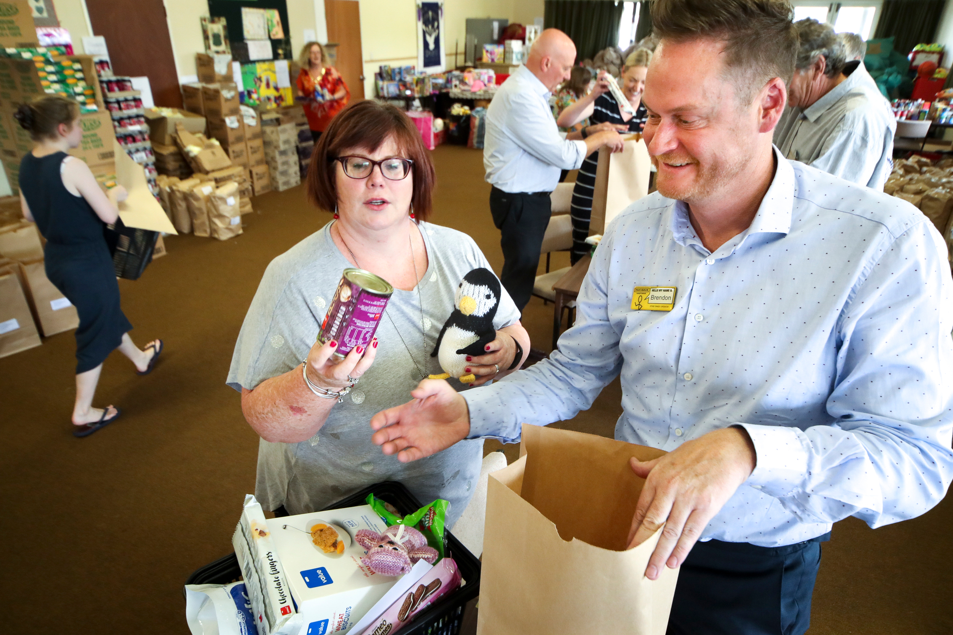 Brendon Smith helps with Christmas Cheer parcels at Flaxmere Baptist Church, Flaxmere. Photo / Warren Buckland 