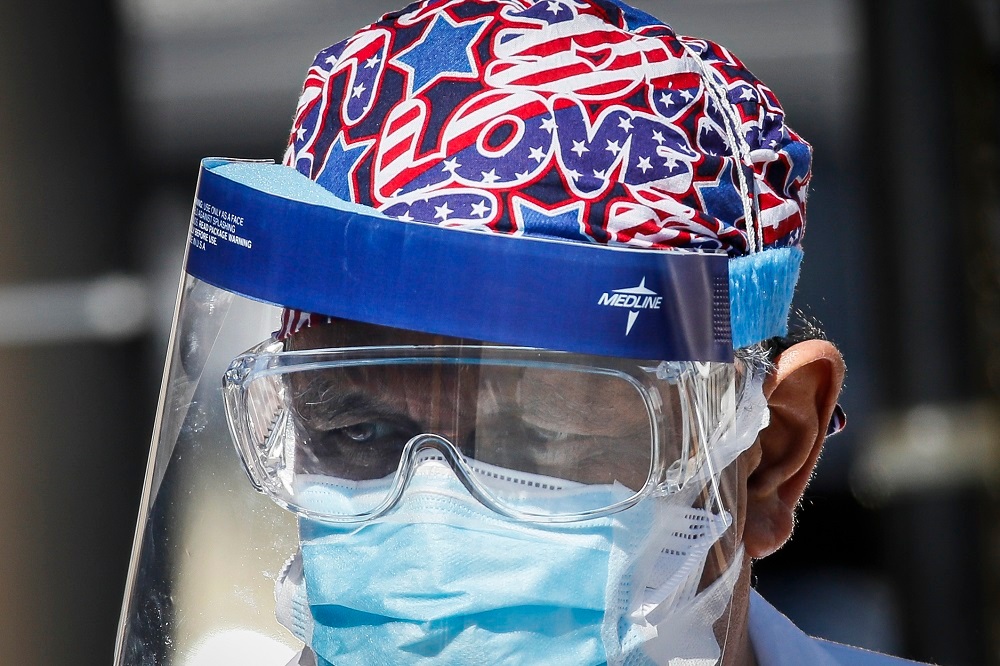 A medical worker wears protective equipment due to Covid-19 risk at Wyckoff Heights Medical Center in New York. Photo / AP, File
