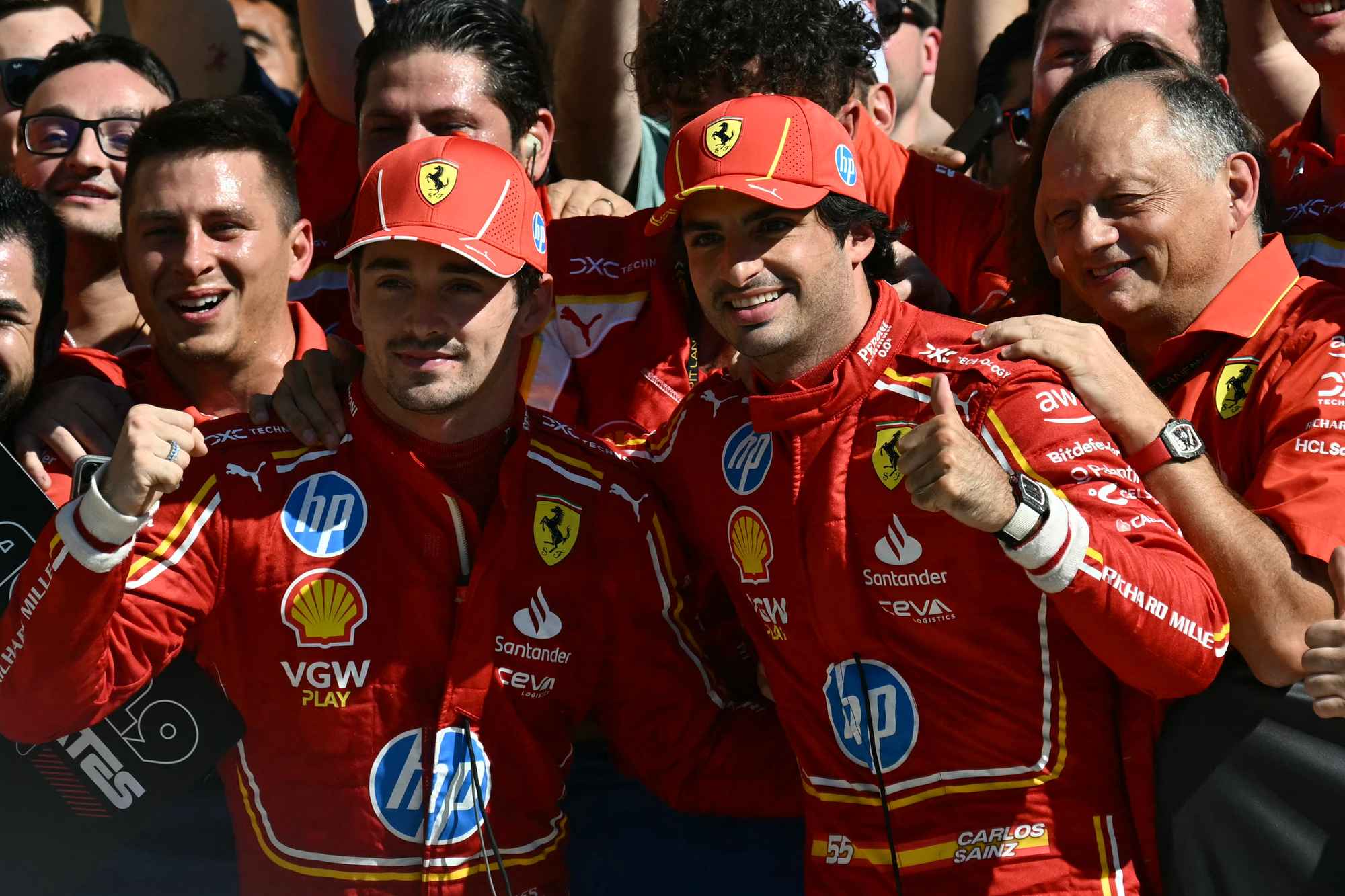 Ferrari's Charles Leclerc and Carlos Sainz celebrate with teammates after Leclerc won the United States Formula One Grand Prix. Photo / AFP