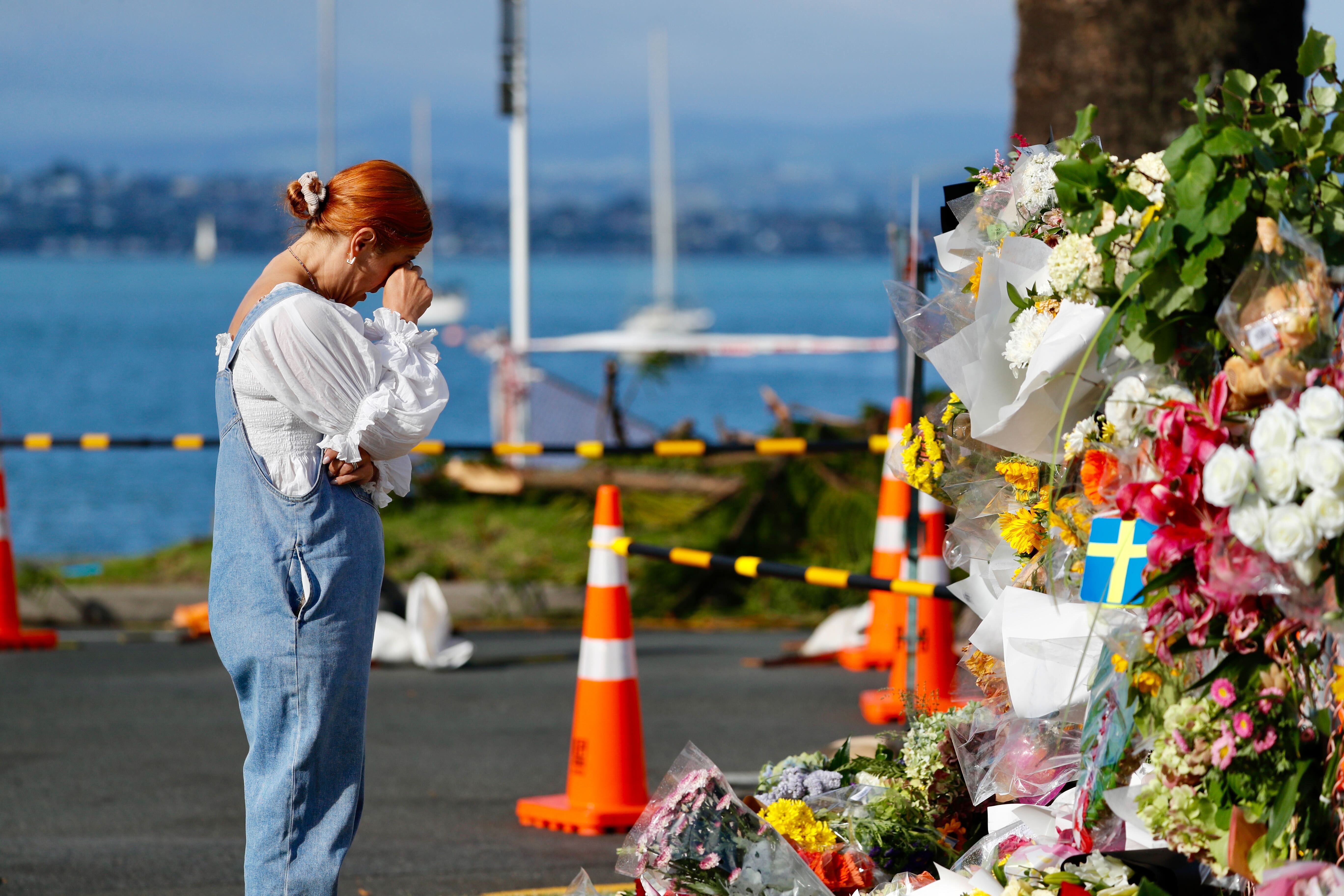 A steady flow of people come to pay their respects at the Mount Maunganui cordon. Photo / Dean Purcell