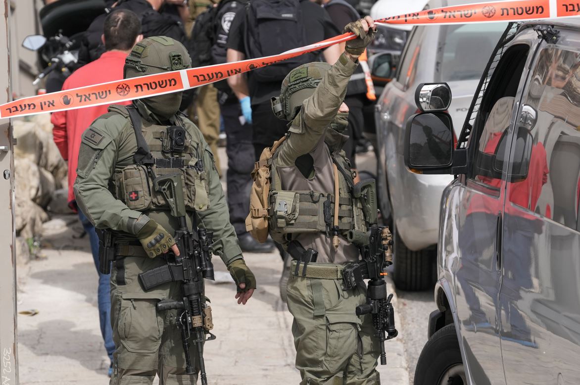 Israeli policemen secure a shooting attack site in east Jerusalem. Photo / AP