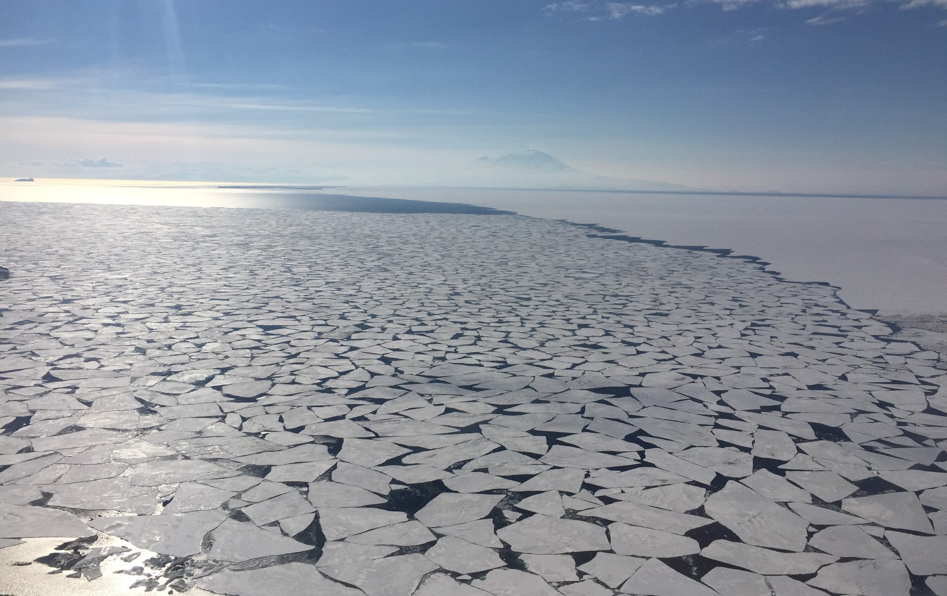 Sea ice near Antarctica's McMurdo Sound, as Mt Erebus looms in the background. Photo / Jamie Morton
