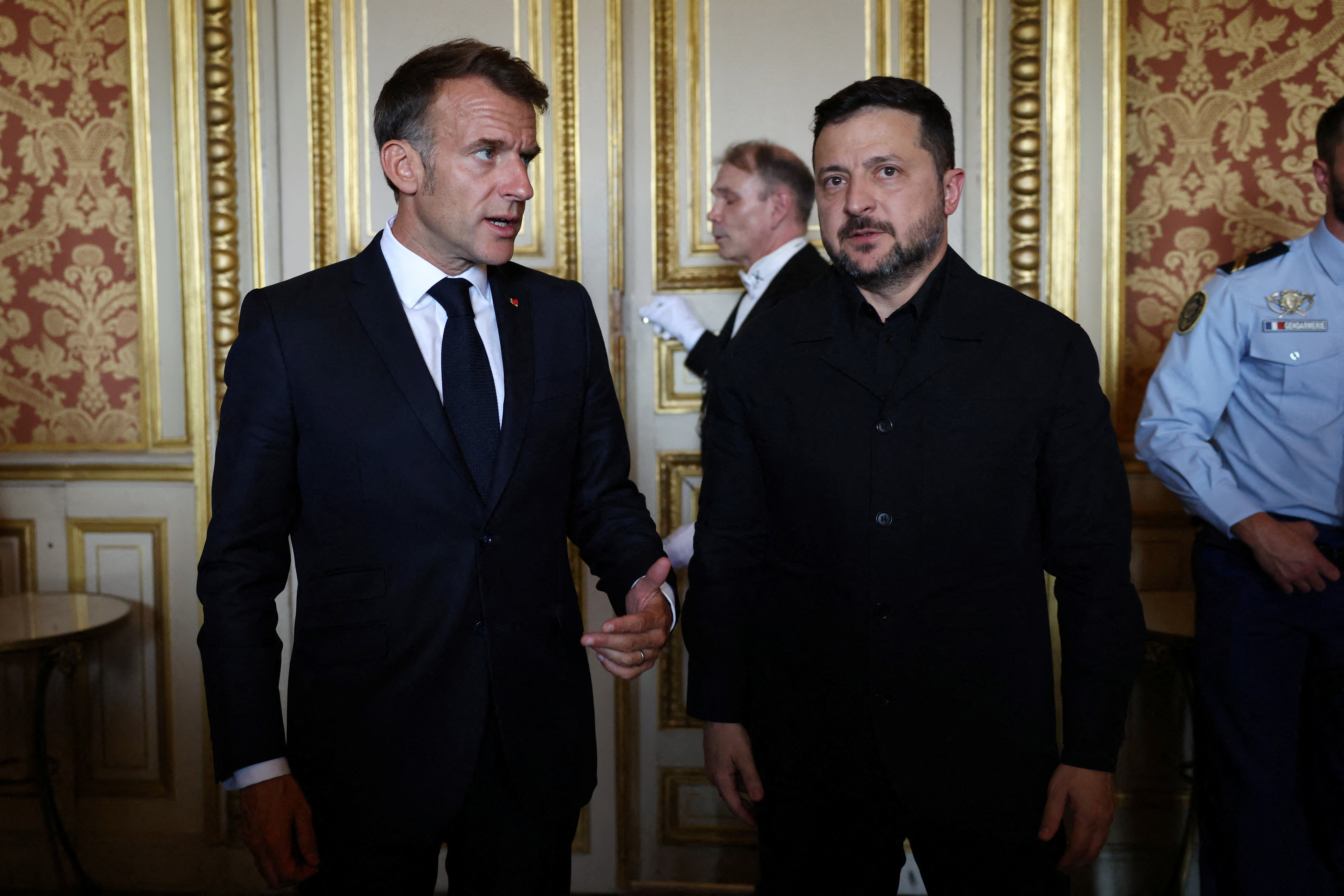 France's President Emmanuel Macron talks with Ukraine's President Volodymyr Zelenskyy before a summit of the Coalition of the Willing in Paris. Photo / Tom Nicholson, AFP