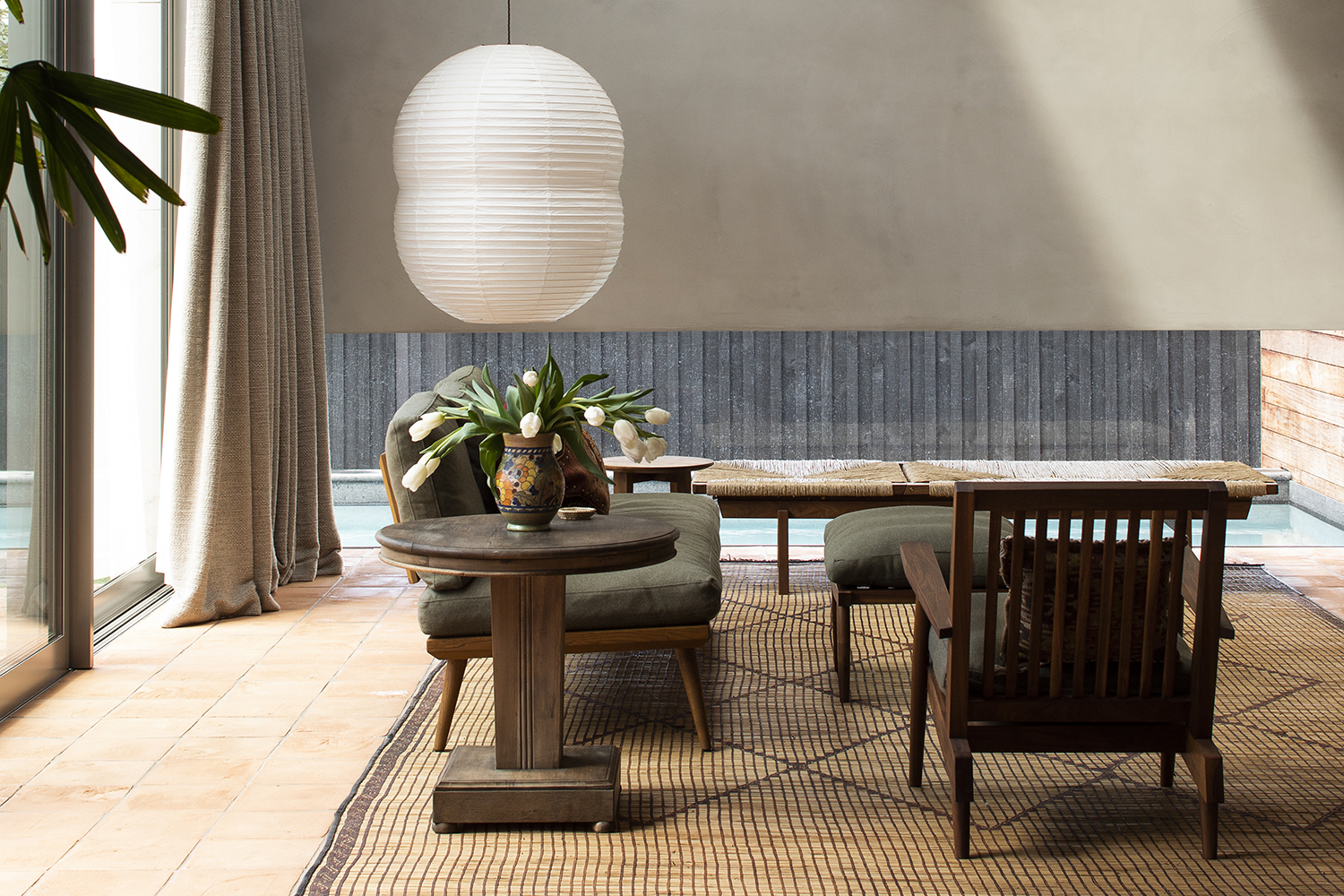 In the living room, a low window provides a view through to the swimming pool. Photo / Supplied