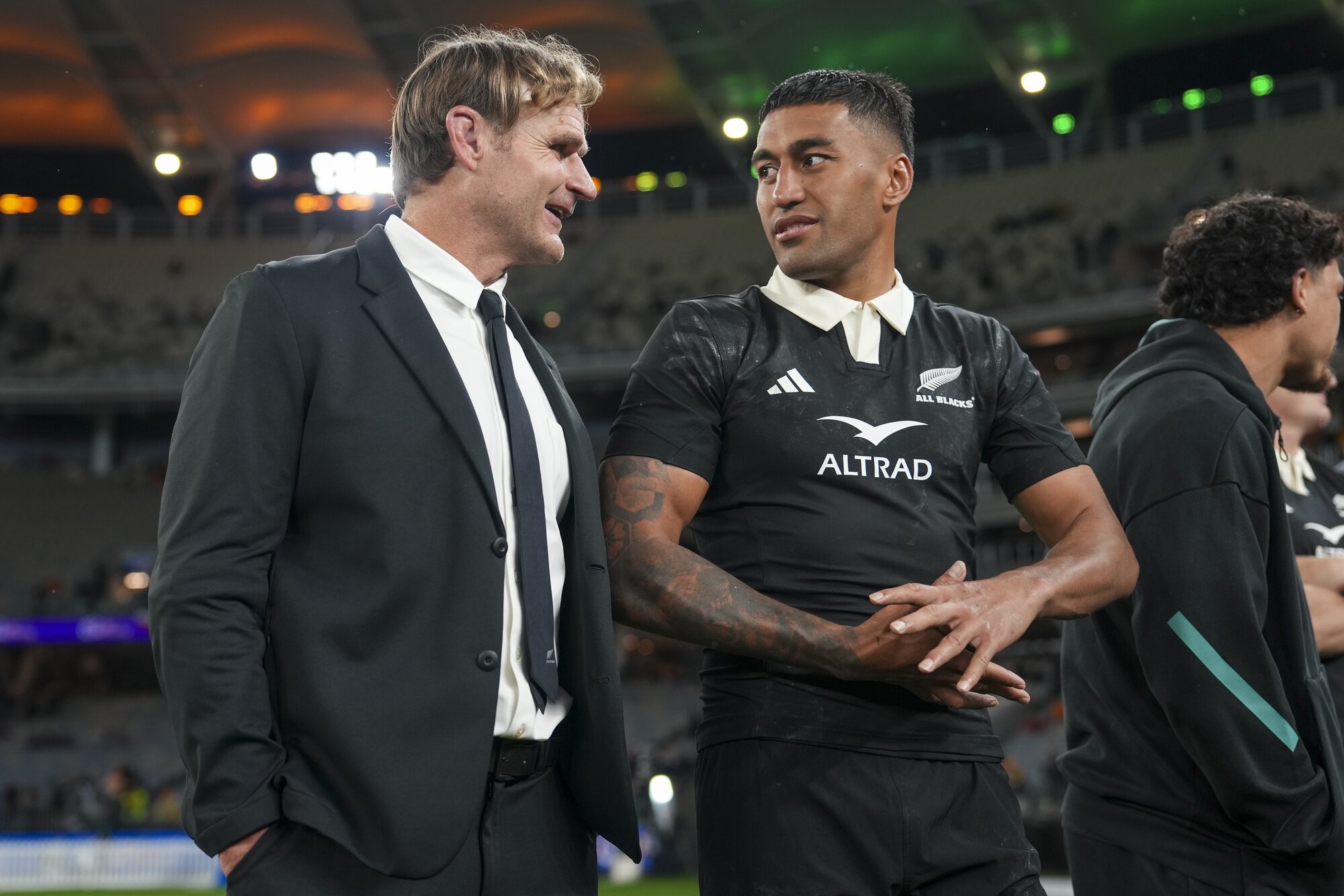 All Blacks coach Scott Robertson (left) and Rieko Ioane catch up after victory over the Wallabies in Perth. Photo / SmartFrame