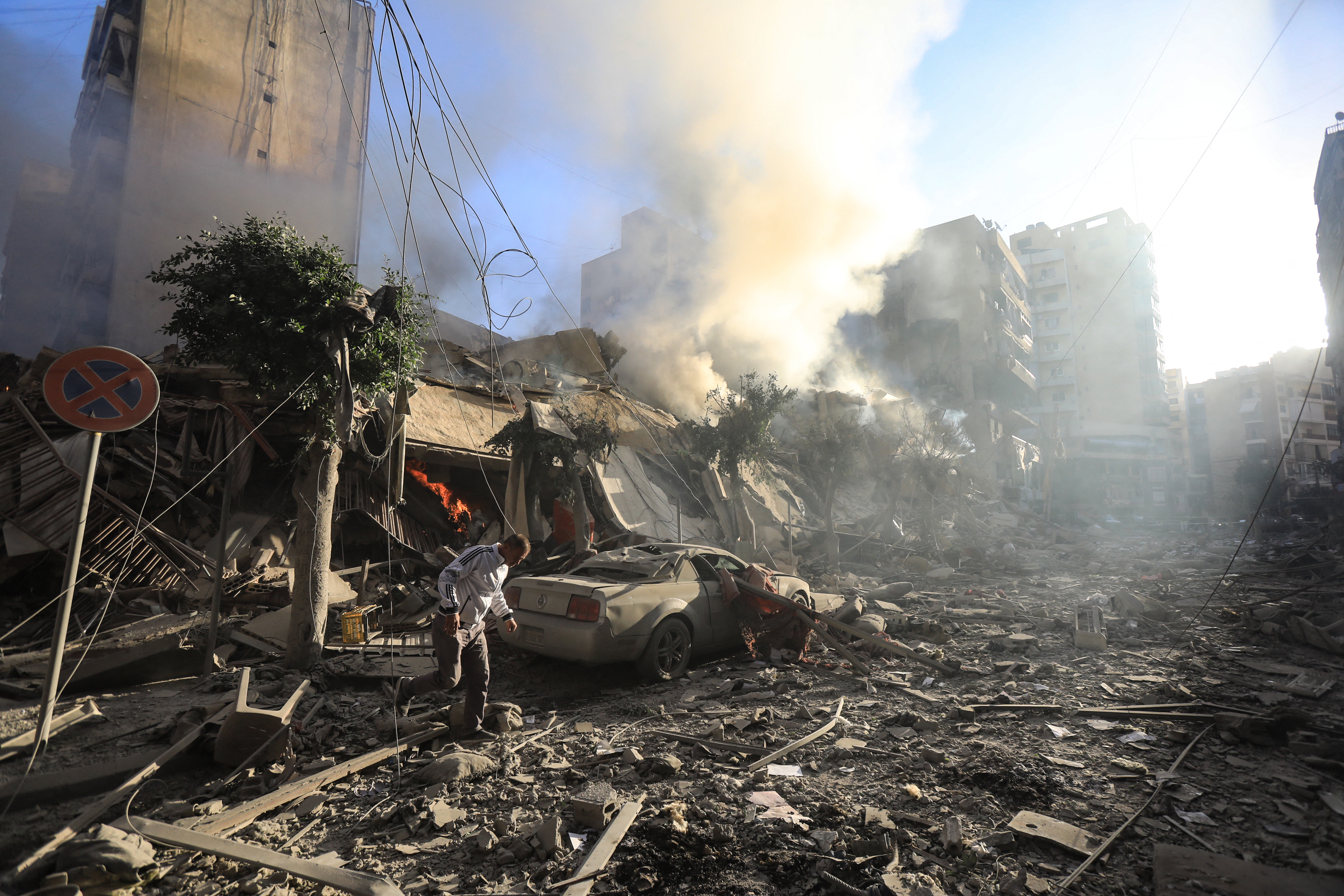A man walks amid the rubble of a building hit in an overnight Israeli airstrike that targeted the neighbourhood of Moawwad in Beirut's southern suburbs. Photo / AFP