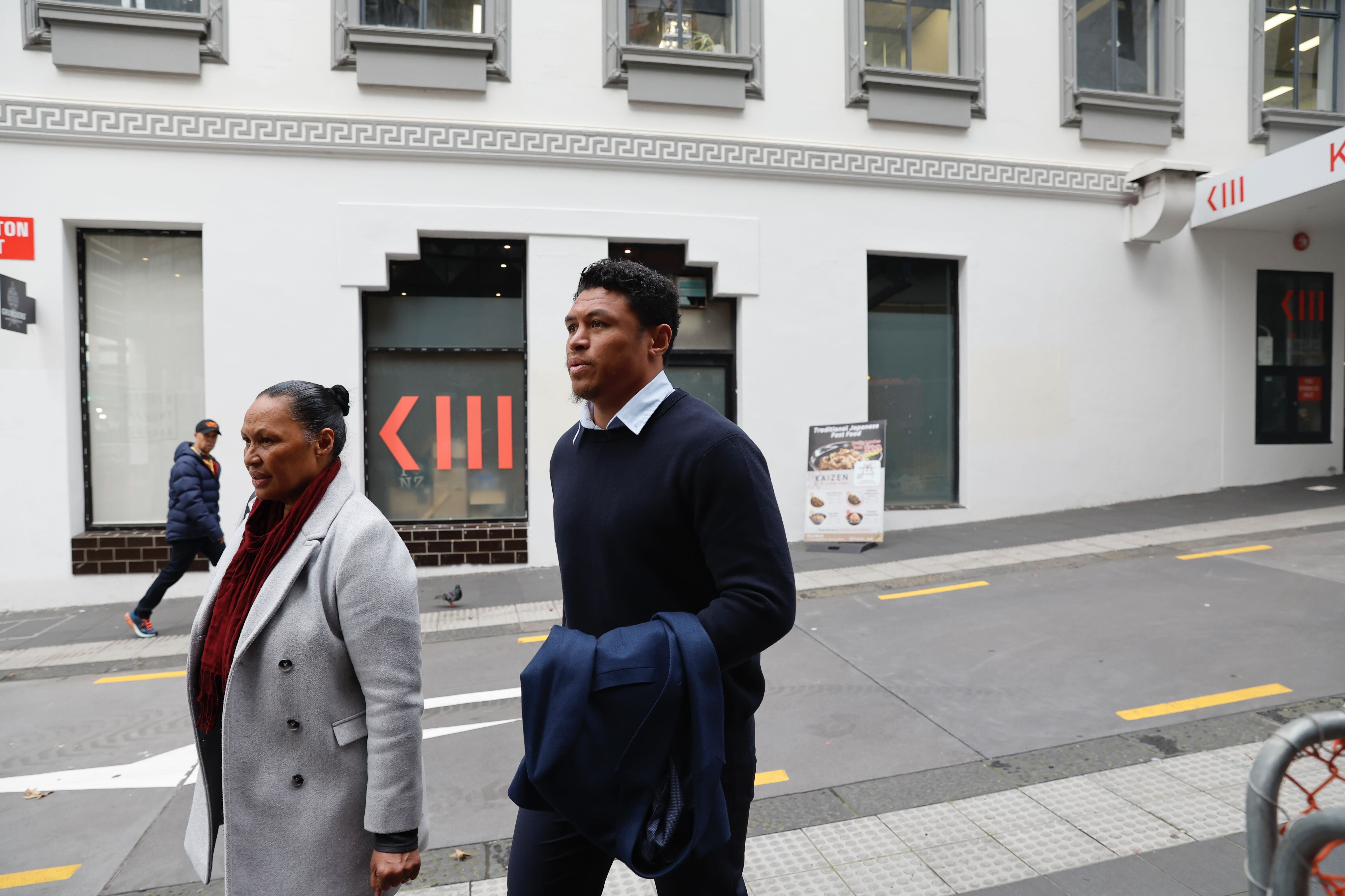 Caleb Clarke arriving at the Auckland District Court with his mother Siala today. Photo / Sylvie Whinray
