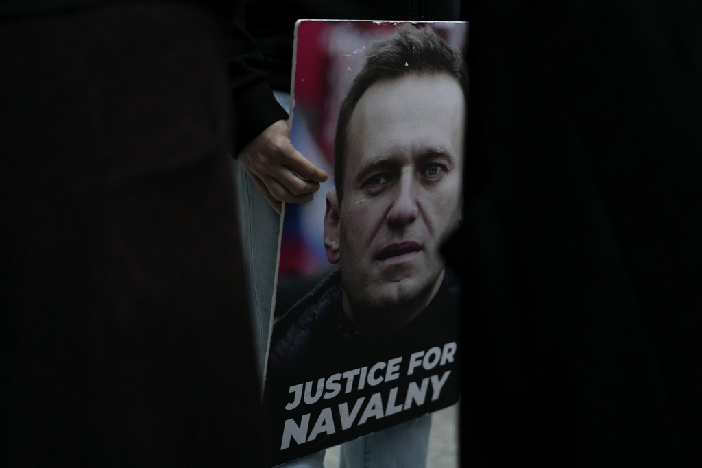 A person holds a picture of Russian opposition leader Alexei Navalny during a vigil in front of the Russian embassy in Lisbon on February 16 following news of his death in an Arctic penal colony. Photo / AP