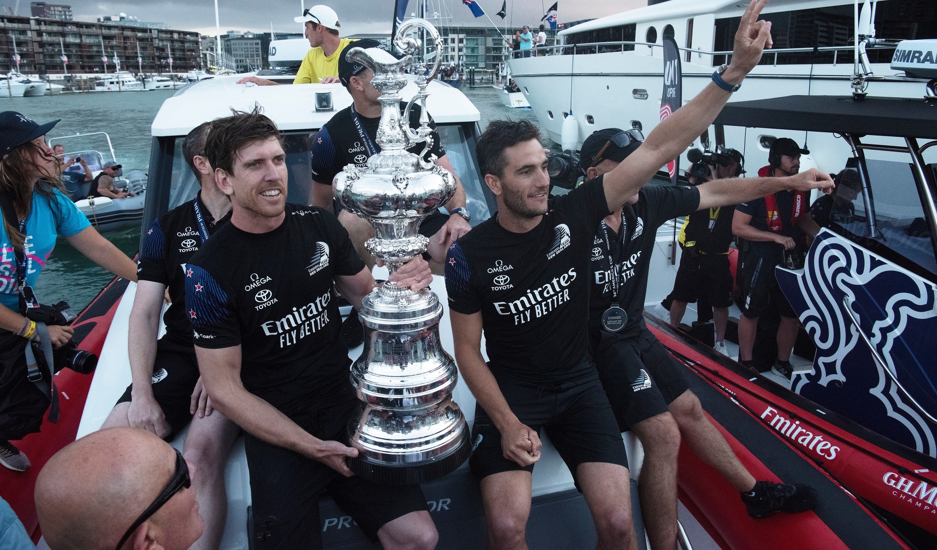 Peter Burling, Blair Tuke and Emirates Team New Zealand celebrate victory with the America's Cup. in 2021. Photo / Photosport