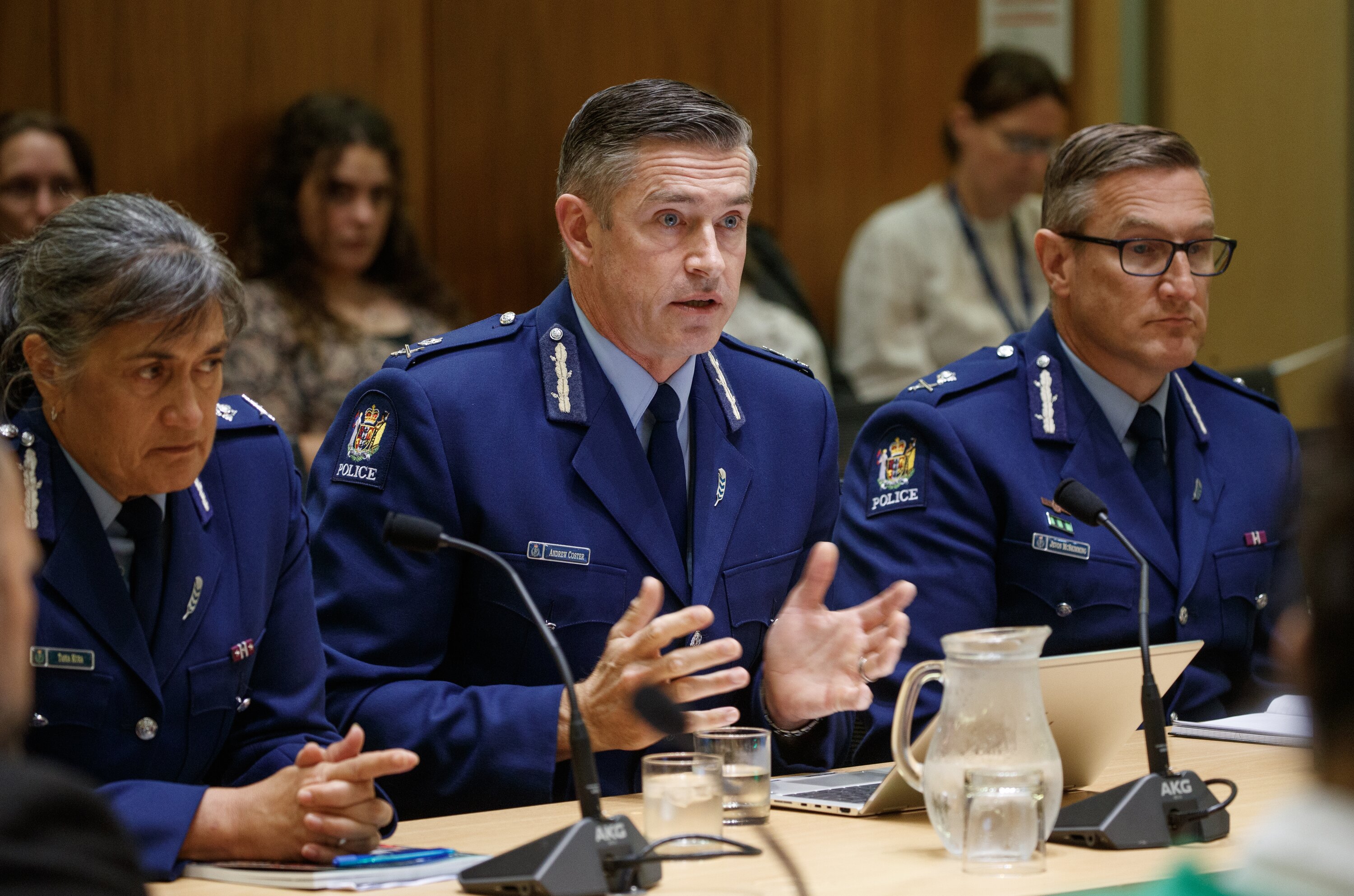Former police deputy commissioner Jevon McSkimming, right, supporting Police Commissioner Andrew Coster, centre, at a select committee hearing at Parliament in 2023. McSkimming was one of the top candidates vying to replace Coster last year. Photo / Mark Mitchell 