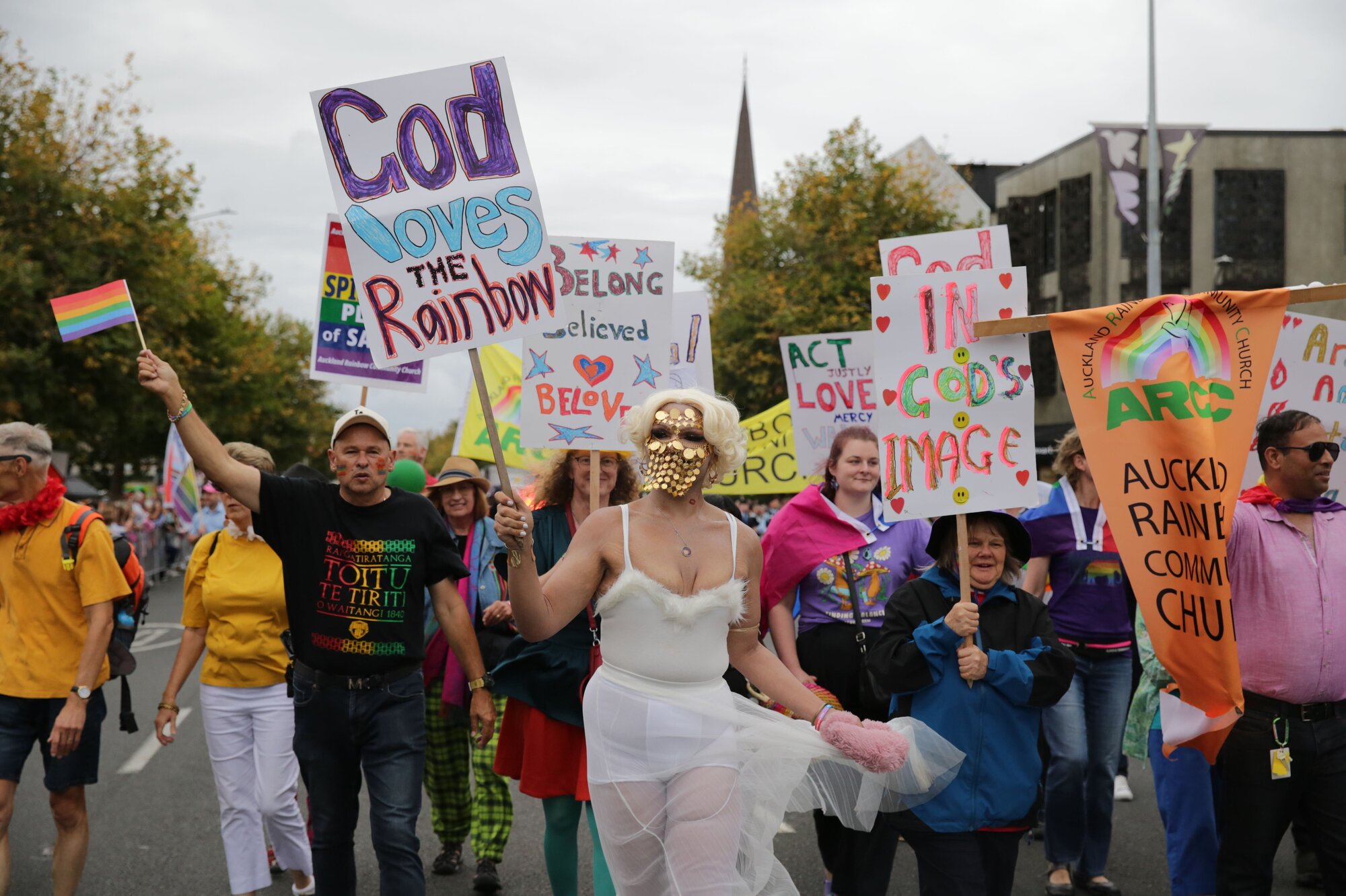 Revellers at the Auckland Rainbow Parade on Ponsonby Rd stand defiant against Destiny Church's Man Up protesters on February 15, 2025. Photo / Sylvie Whinray