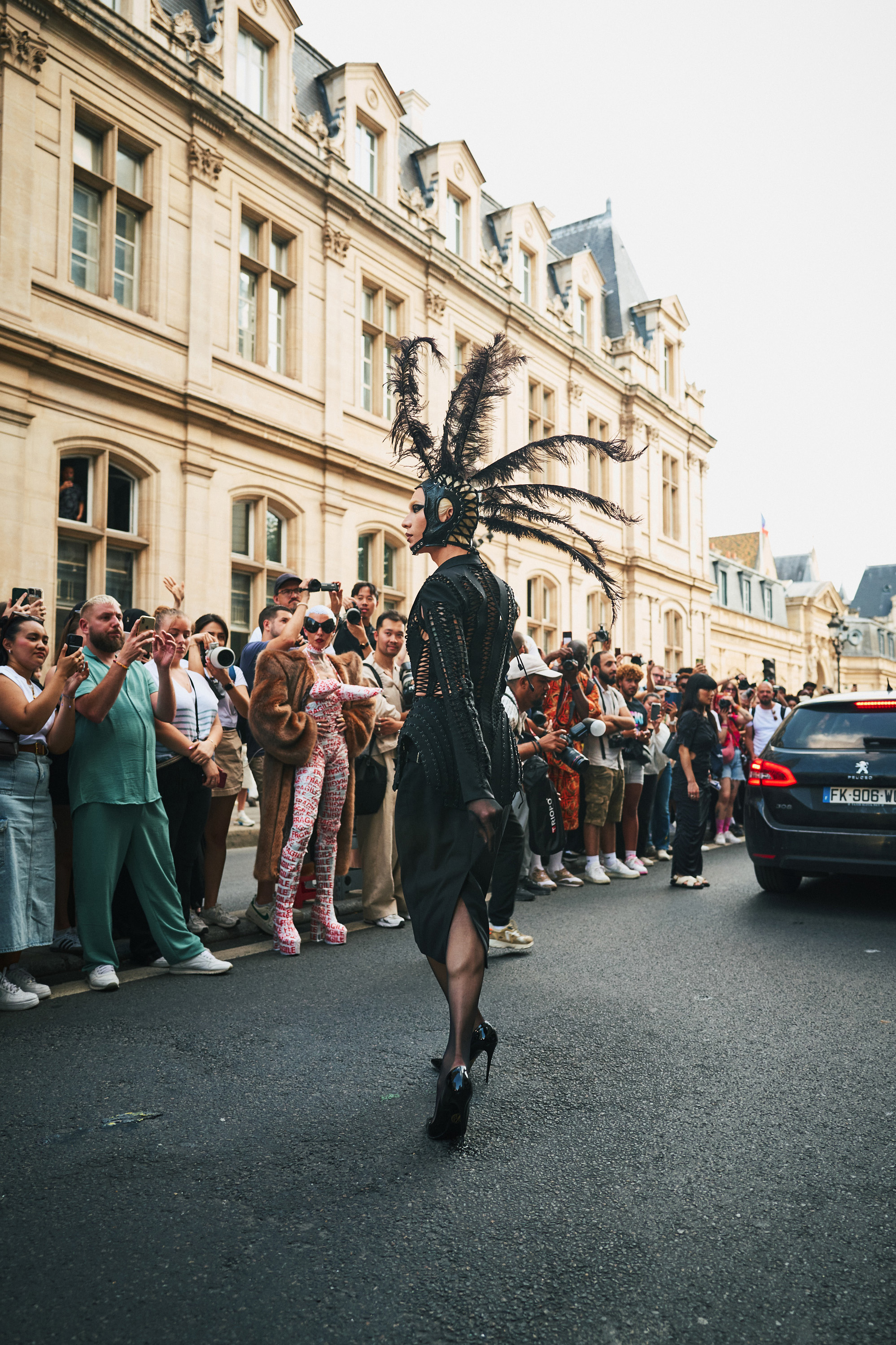 Miss Fame, a drag artist, turns the street into a runway during Couture Week. Photo / New York Times